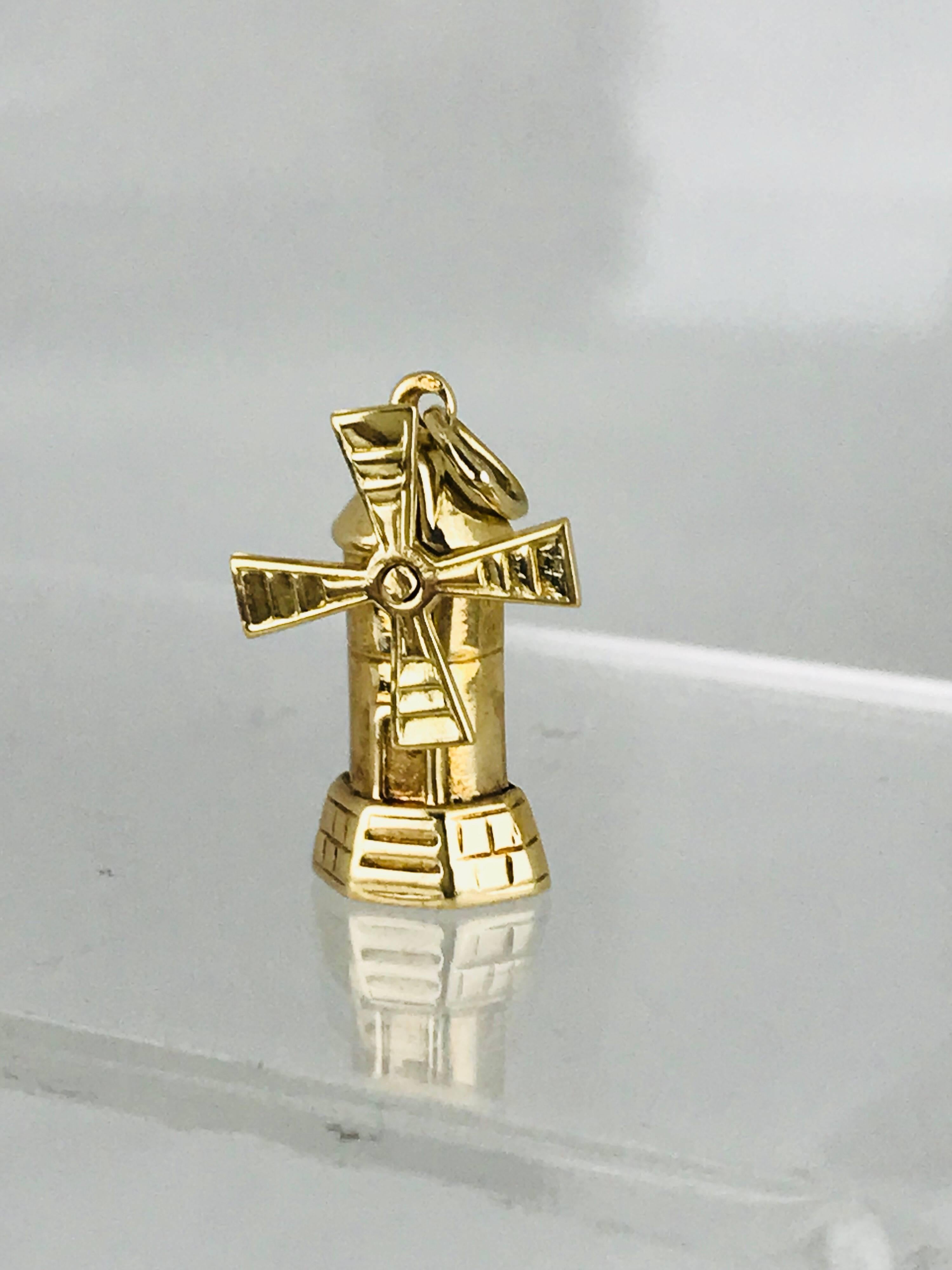 Windmill, With Movable Mill, 14 Karat Yellow Gold, Circa 1930's
Vintage, unique and hard to find Windmill can be used for charm bracelet or necklace

GIA Gemologist, inspected & evaluated