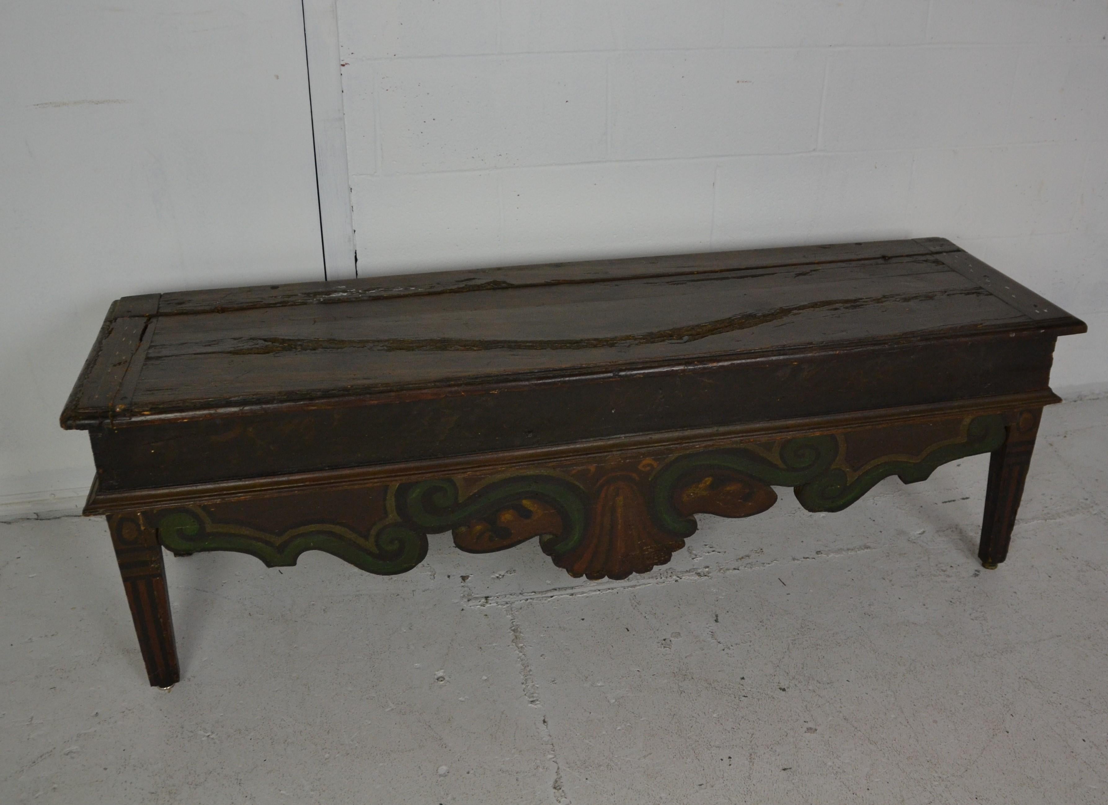 A walnut storage bench with hand painted skirt. Loop hinges. Ideal as a window seat, also works as a bench for the foot of the bed, 1680-1720.