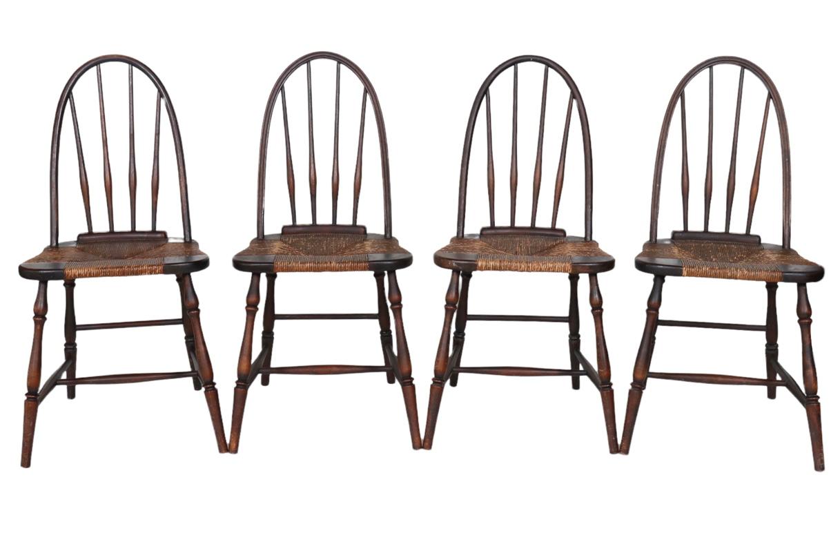A set of 4 (four) vintage, smaller scale Windsor style dining chairs. USA, early to mid-20th Century. 

Features classic details, a wood frame and rush seat. All original.

Seat height, 17.5 inches.