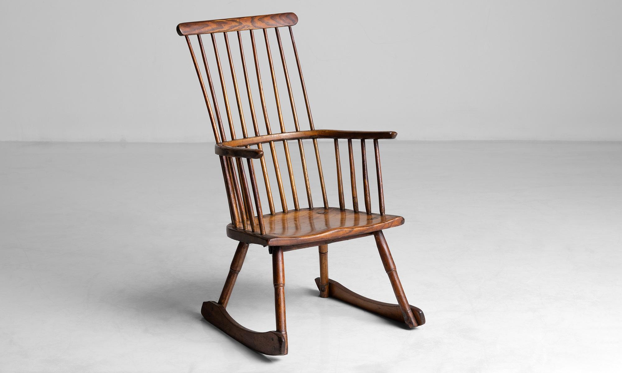 Windsor rocking chair.

England circa 1900.

Spindle back rocking chair in original finish.

Measures: 23.25”L x 23”D x 41.25”H.