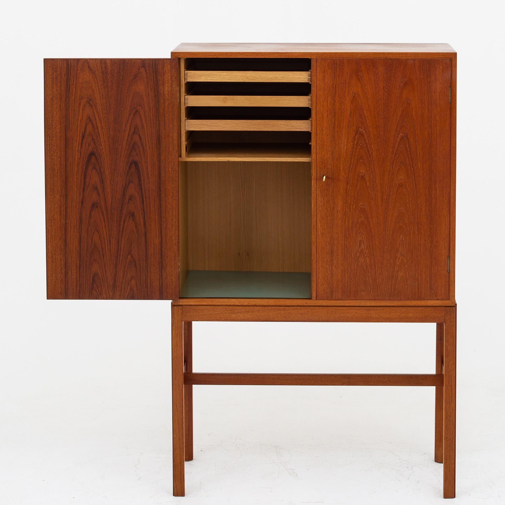 Wine and tobacco cabinet in teak with decor. Maker Thorald Madsen.