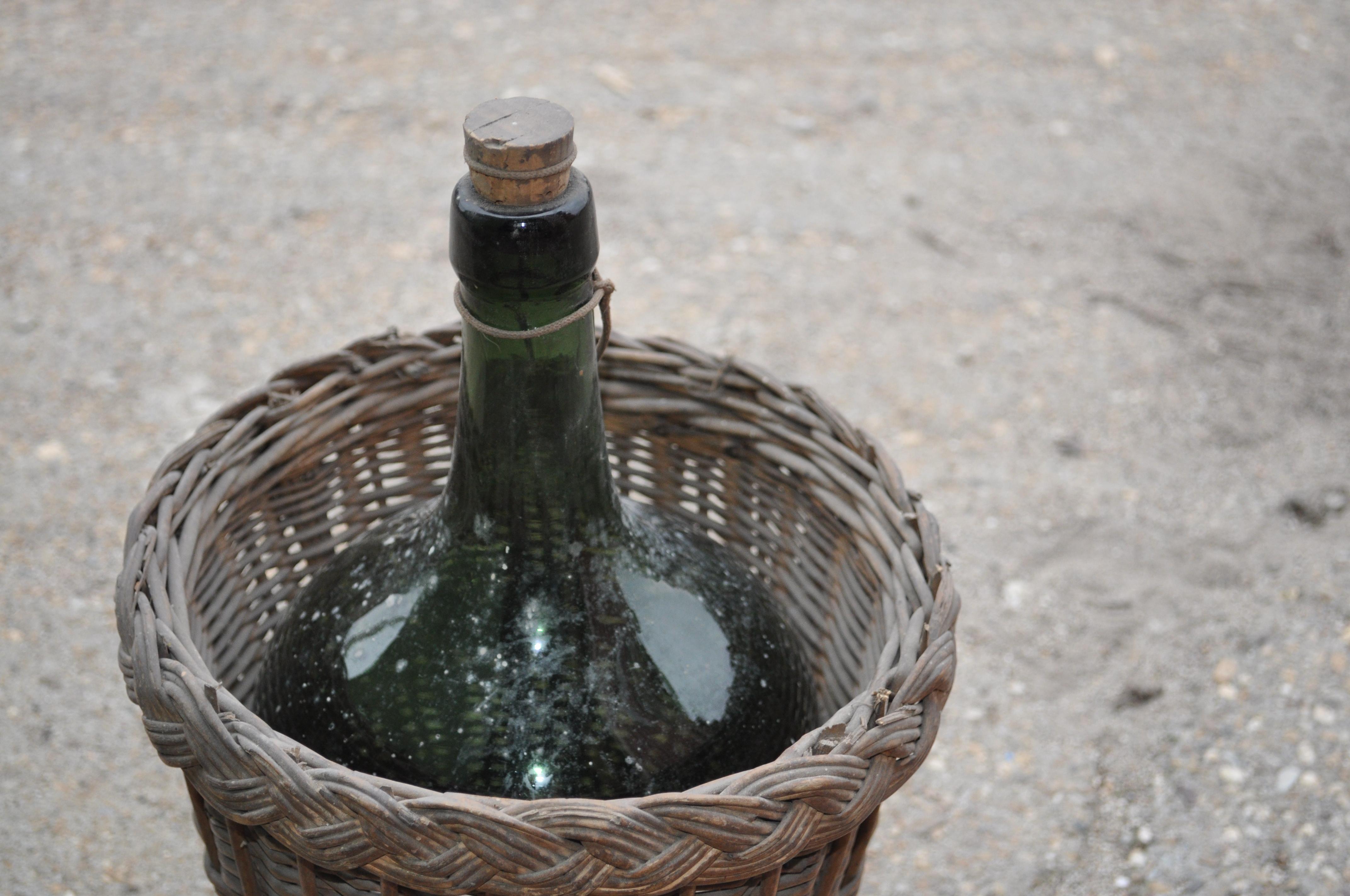 Wicker Wine Bottle and Basket, circa 1920 For Sale