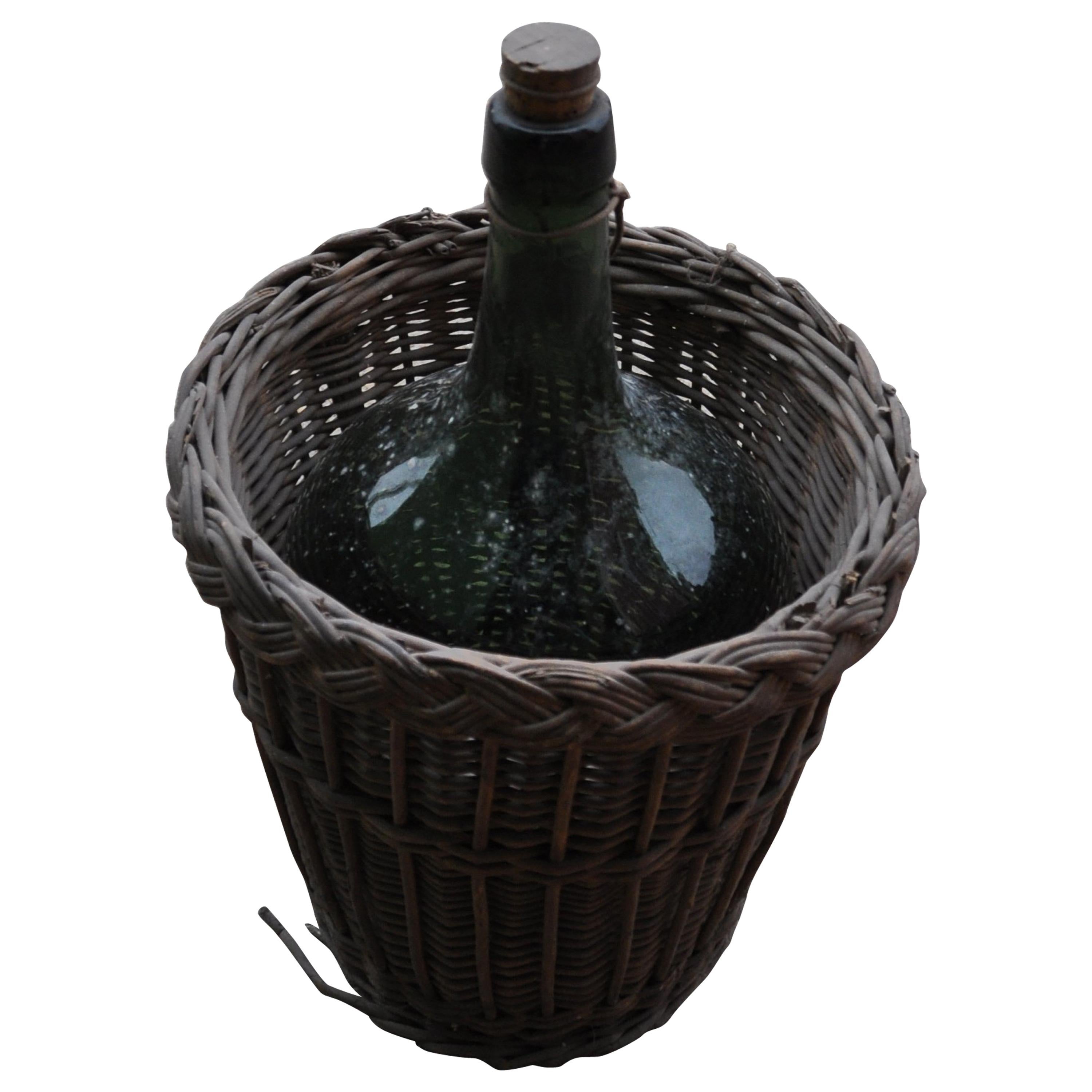 Wine Bottle and Basket, circa 1920 For Sale