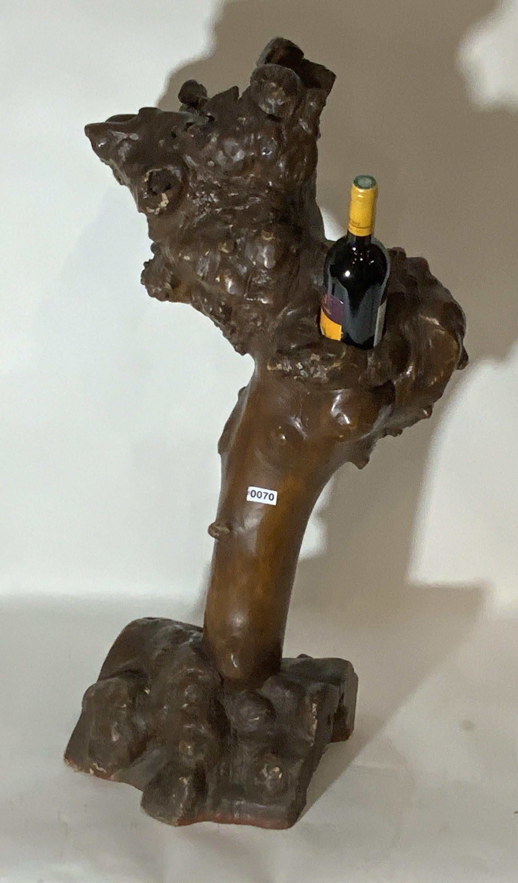 Unique wine rack made from tree root or burl. Made to hold five bottles. Very decorative. Perfect accent for your wine cellar. 39