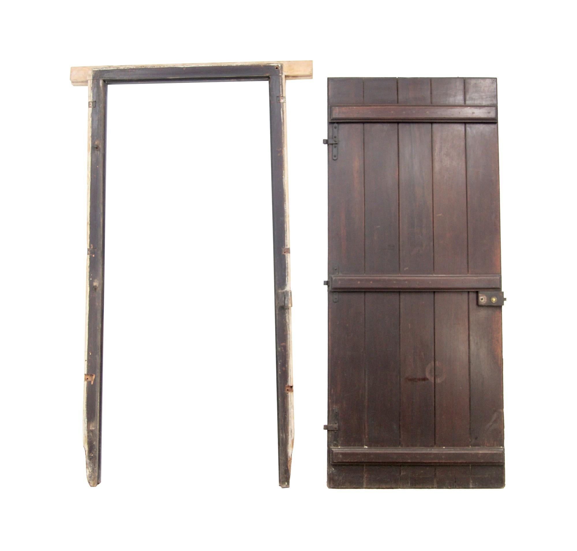 1920's reclaimed wine cellar door originally from Buenos Aires. This door comes complete with frame and original hardware. The wood is likely Spanish cedar and consists of 5 vertical wood planks. This can be seen at our 400 Gilligan St location in