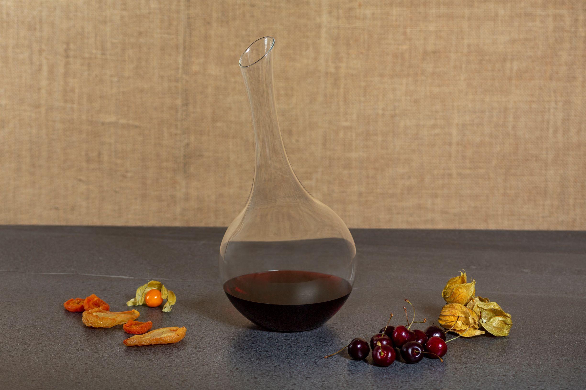 The wine decanter is an organically shaped hand-blown borosilicate glass carafe. 

The Pok collection celebrates the artistry of hand-crafted beadwork made by the Pokot women in Northwest Kenya. Influenced by the hand-carved African gourd fruit