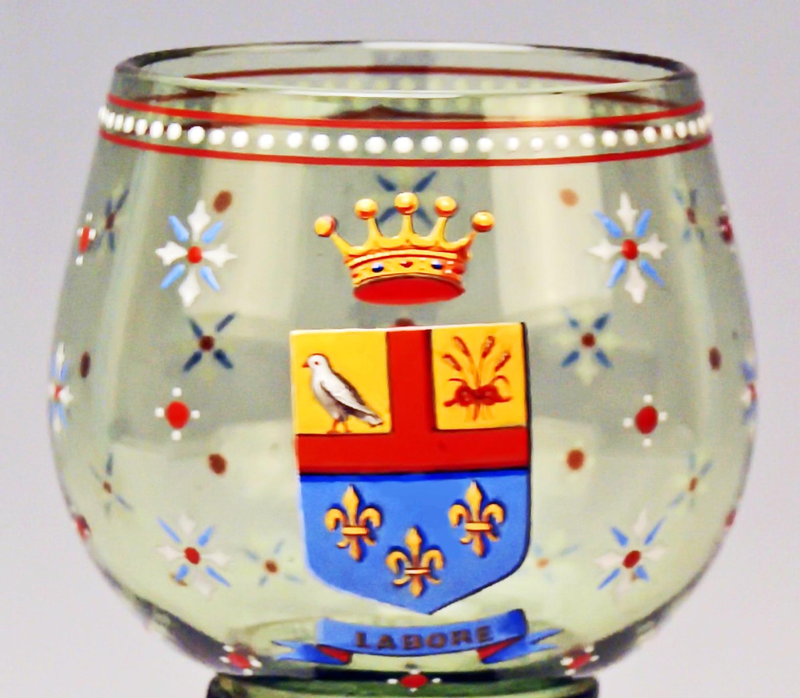 Lobmeyr wine glass (of stunning manufacturing quality!), based on round tiered foot: Green glass, handmade (blown and formed) with enamel paintings
Made circa 1910-1915
Painted by multicolored opaque enamel:
White borders looking like pearls