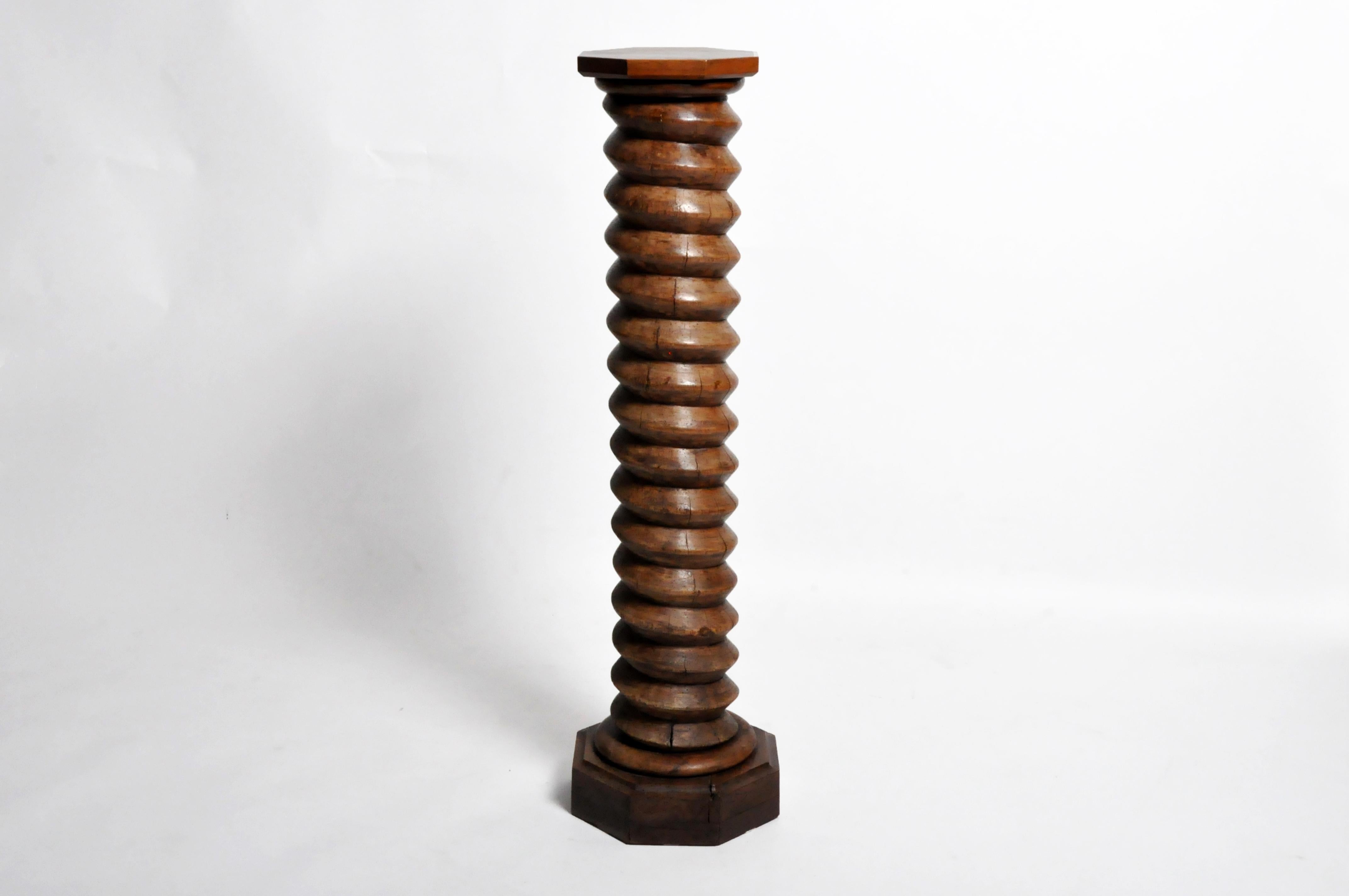 Wine presses have been used for centuries the earliest one discovered dates back 6,000 years. This 19th century hand carved screw was likely salvaged from a basket press or horizontal screw press used in a French vineyard. The shelf on top and