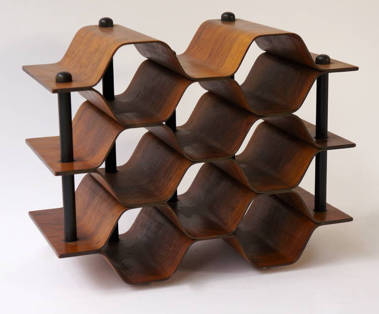 Beautiful wine rack designed by Torsten Johansson for AB Formtra¨ in Sweden, circa 1960.

The rack is made of beautiful rosewood with metal horizontal supports. It's eye-catching shape resembles a honeycomb that holds up to eight wine bottles.