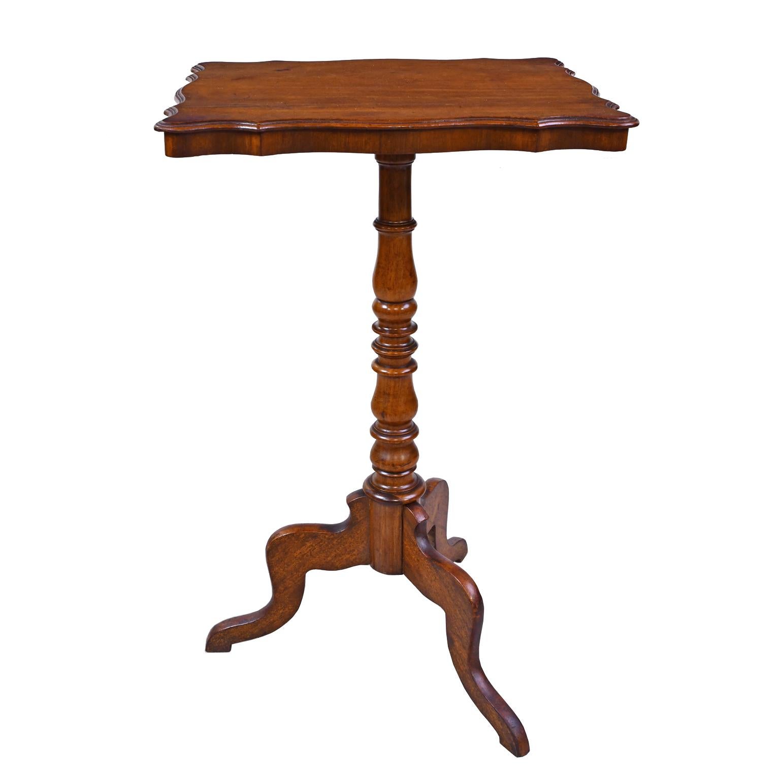 A handsome wine table or candlestand in walnut on tripod pedestal base with turned column resting on cabriole legs. European, possibly Dutch or German, circa 1825.
Measurements: 20 1/2