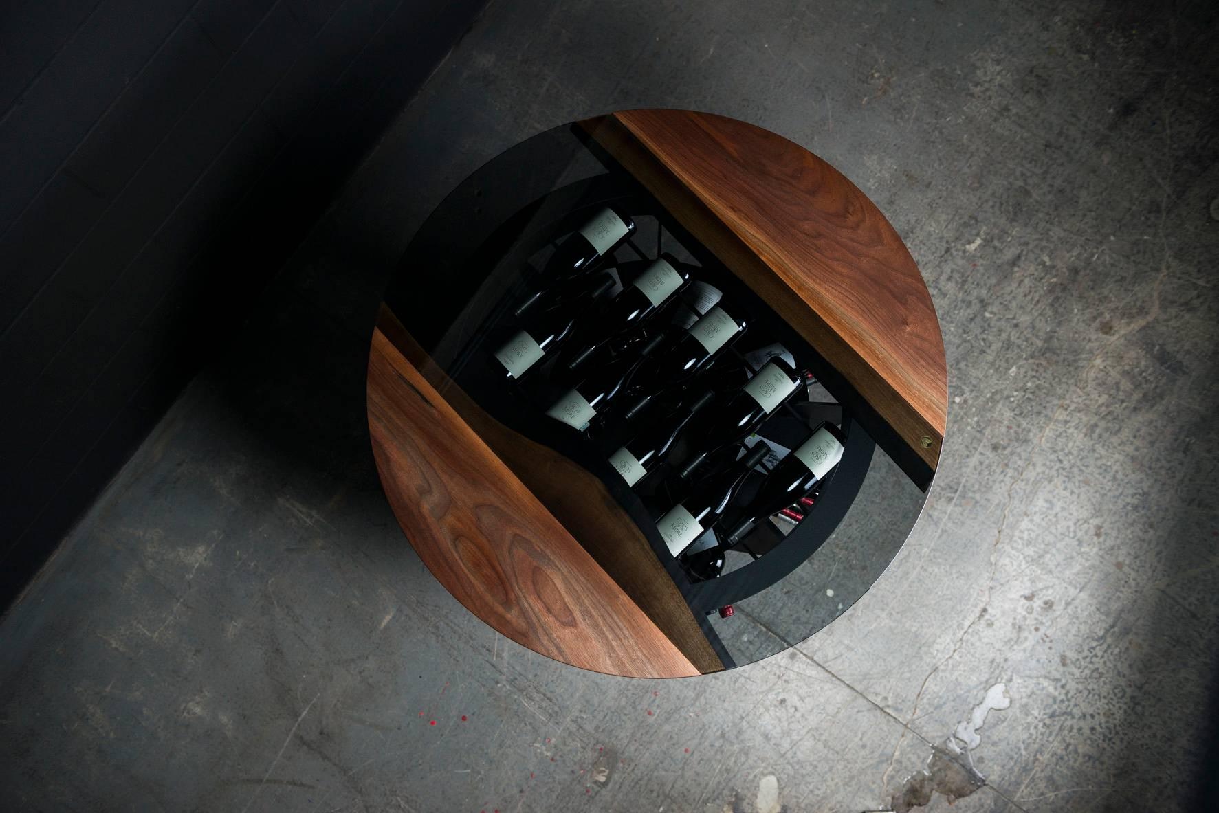 Our wine tasting and storage round table is handmade to order from an hand selected unique black walnut slab with an hand rubbed natural oil and wax finish that enhance the real beauty of the wood and give a natural warm touch. The seamless tinted