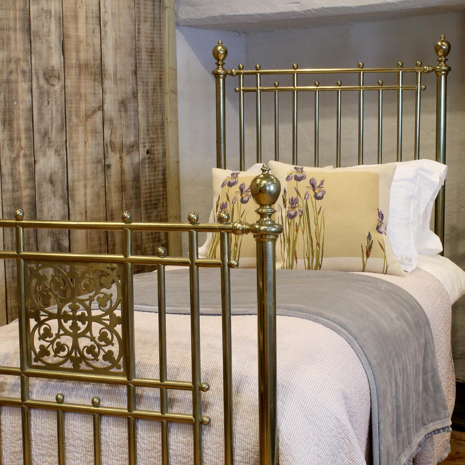 A magnificent top quality all brass Victorian single antique bed manufactured by R. W. Winfield & Co, as shown by a brass plaque on the cross iron of the foot end. These manufacturers from Birmingham fashioned the highest quality brass beds and this