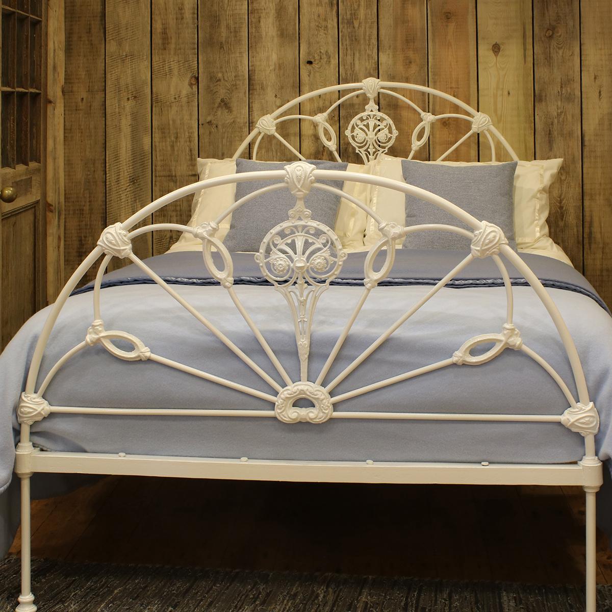 A superb example of a Victorian cast iron double bed attributed to the leading manufacturer of cast iron beds, R W Winfield of Birmingham UK, finished in 