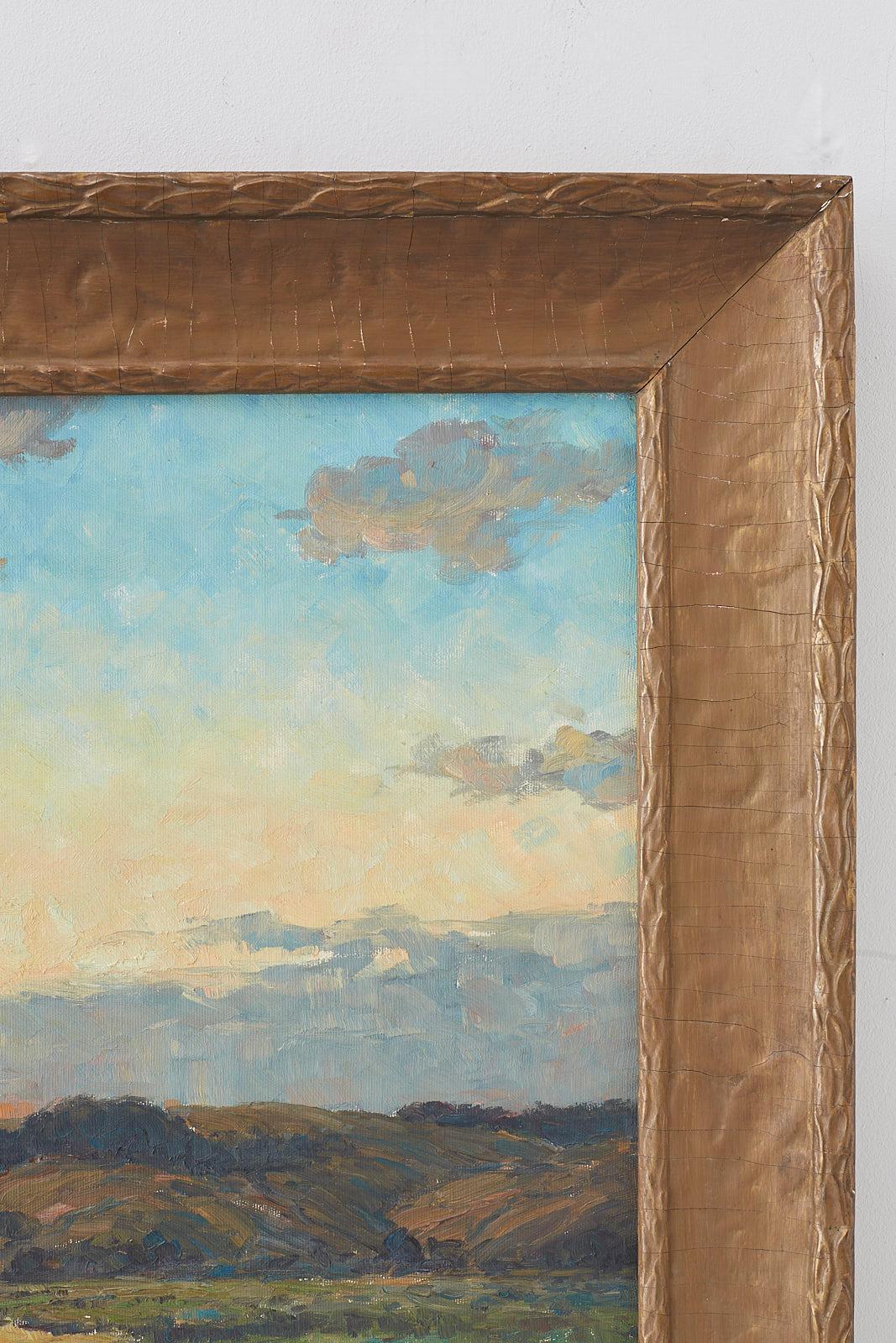 Early oil on canvas painting by Winfield Scott Clime (American 1881-1958) 30 inches wide by 25 inches high. Sublime landscape painting of a sunrise set in a gilt wood and gesso frame with a distressed and faded patina. Signed and dated 1912 on