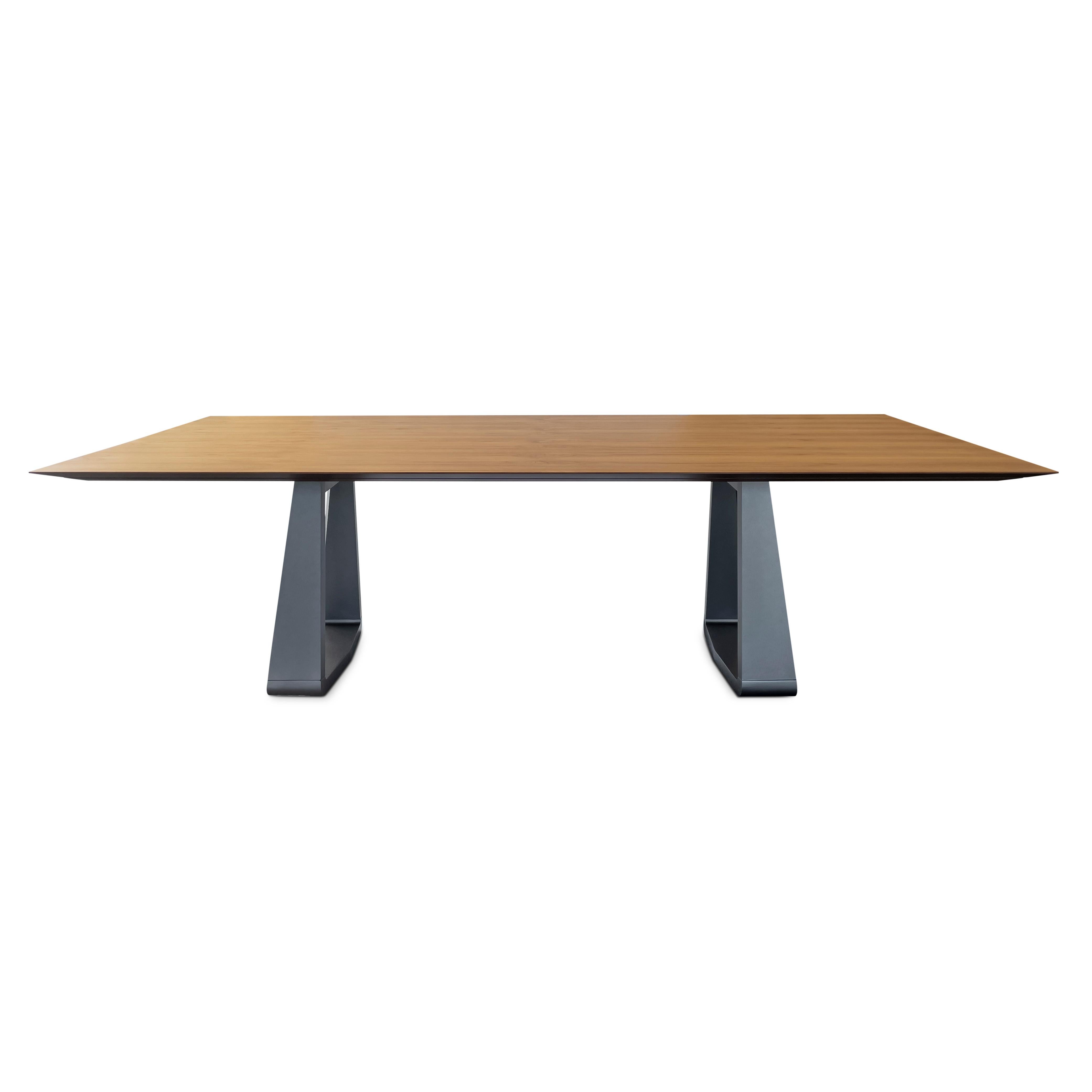 The Wing dining table is a beautiful chamfered piece in a teak veneered table top and a minimalist graphite-painted base. Combining all these details the amazing Uultis team has created this dining table for any type of decor at your home because of