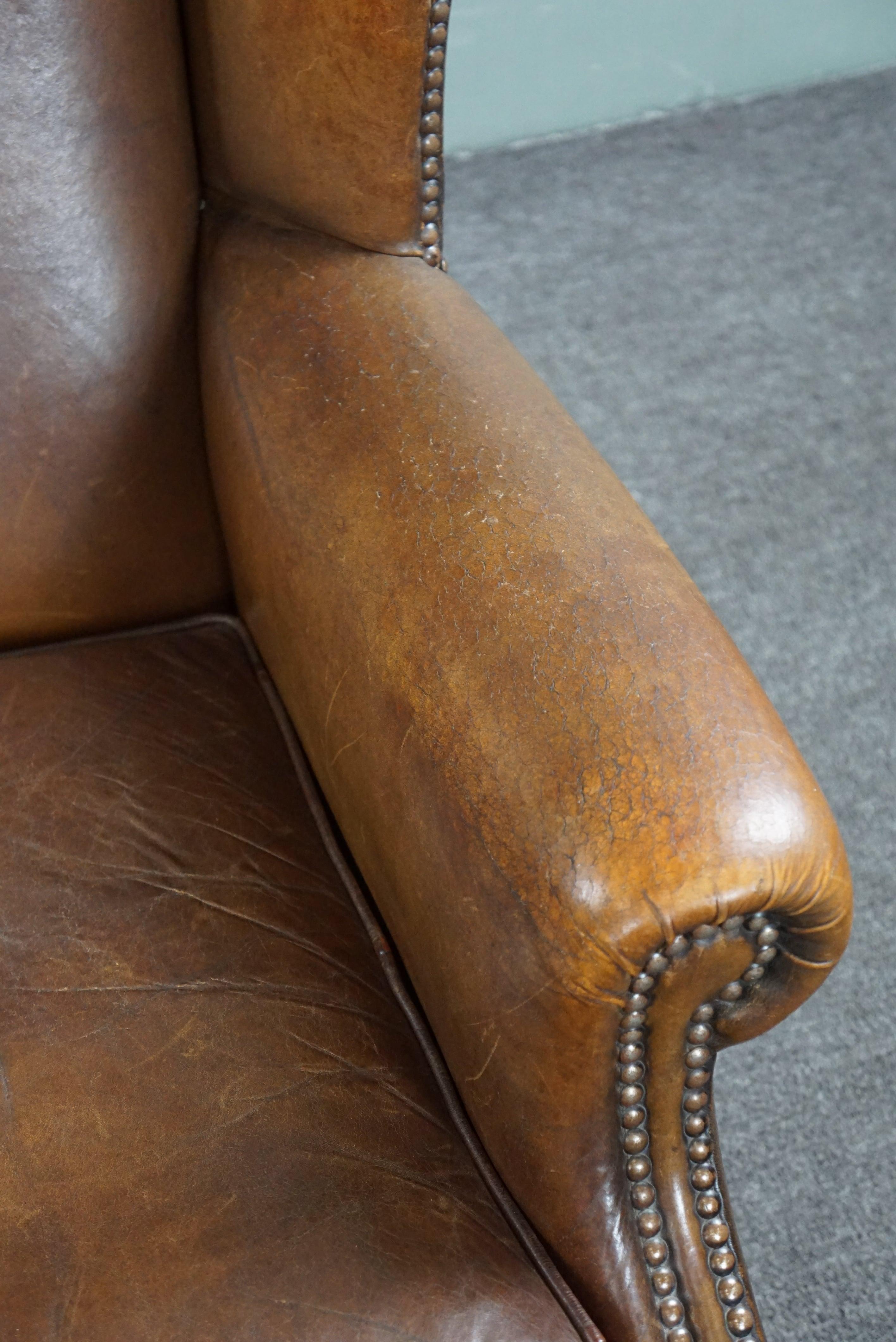 Wing armchair full of character, made of sheep leather For Sale 3