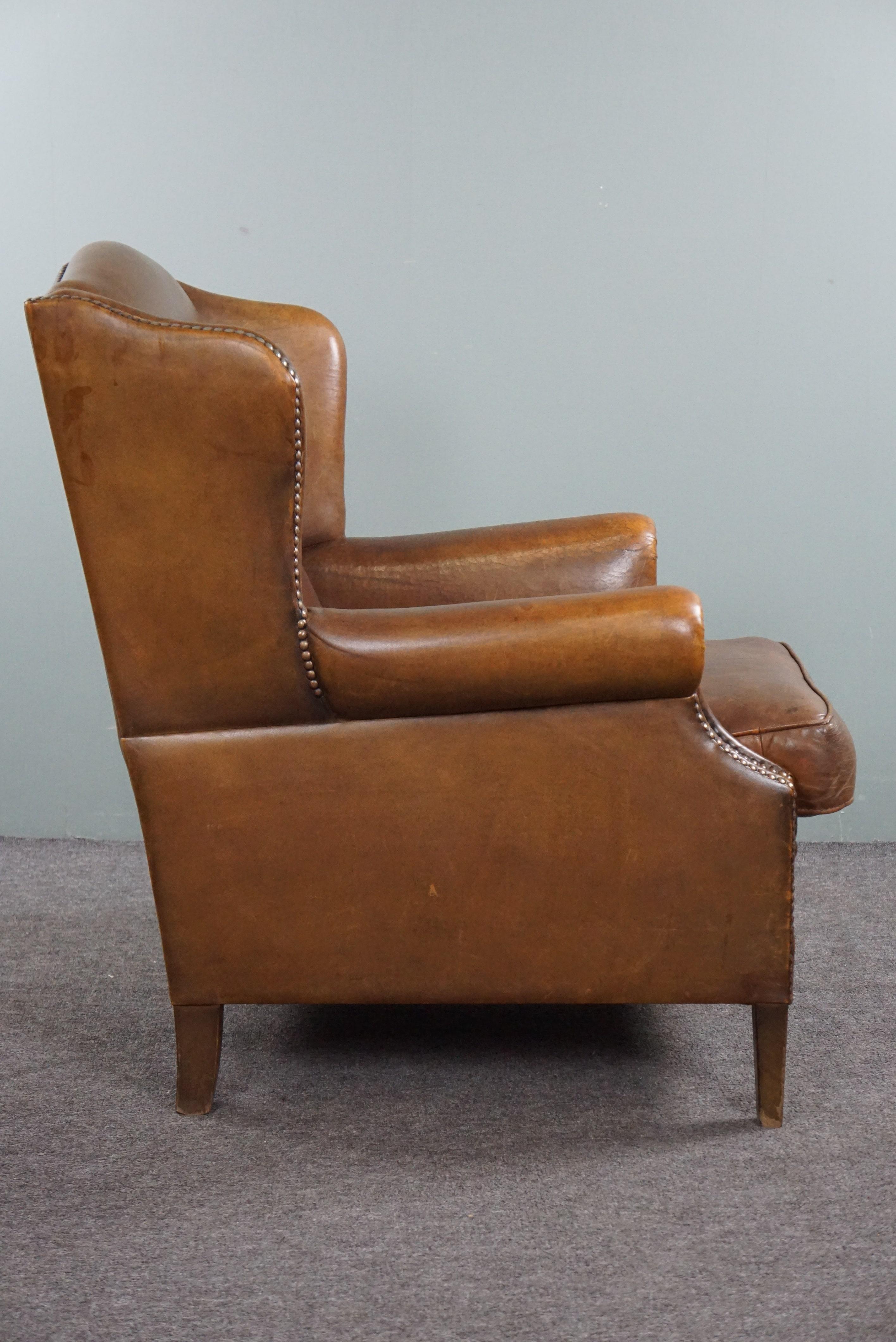 Dutch Wing armchair full of character, made of sheep leather For Sale