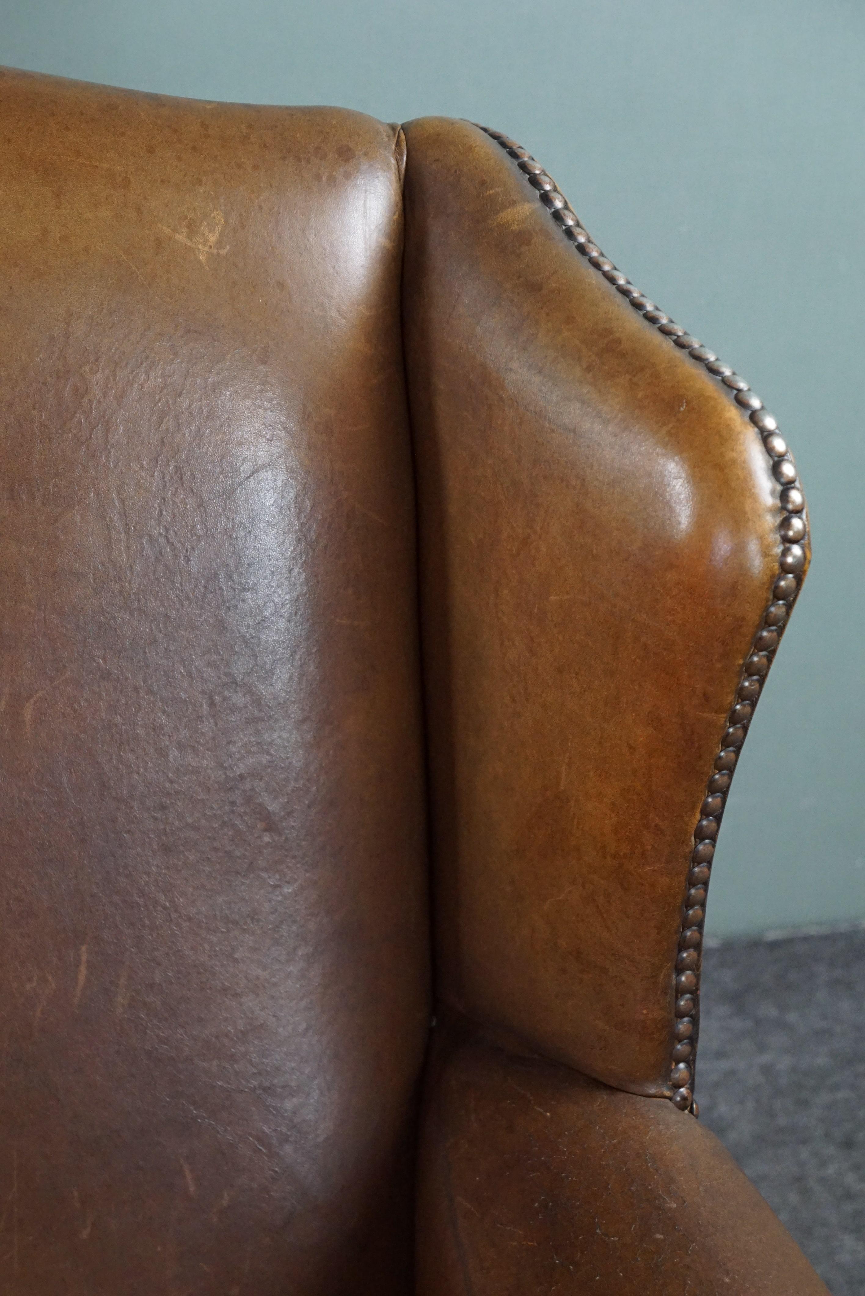 Wing armchair full of character, made of sheep leather For Sale 1