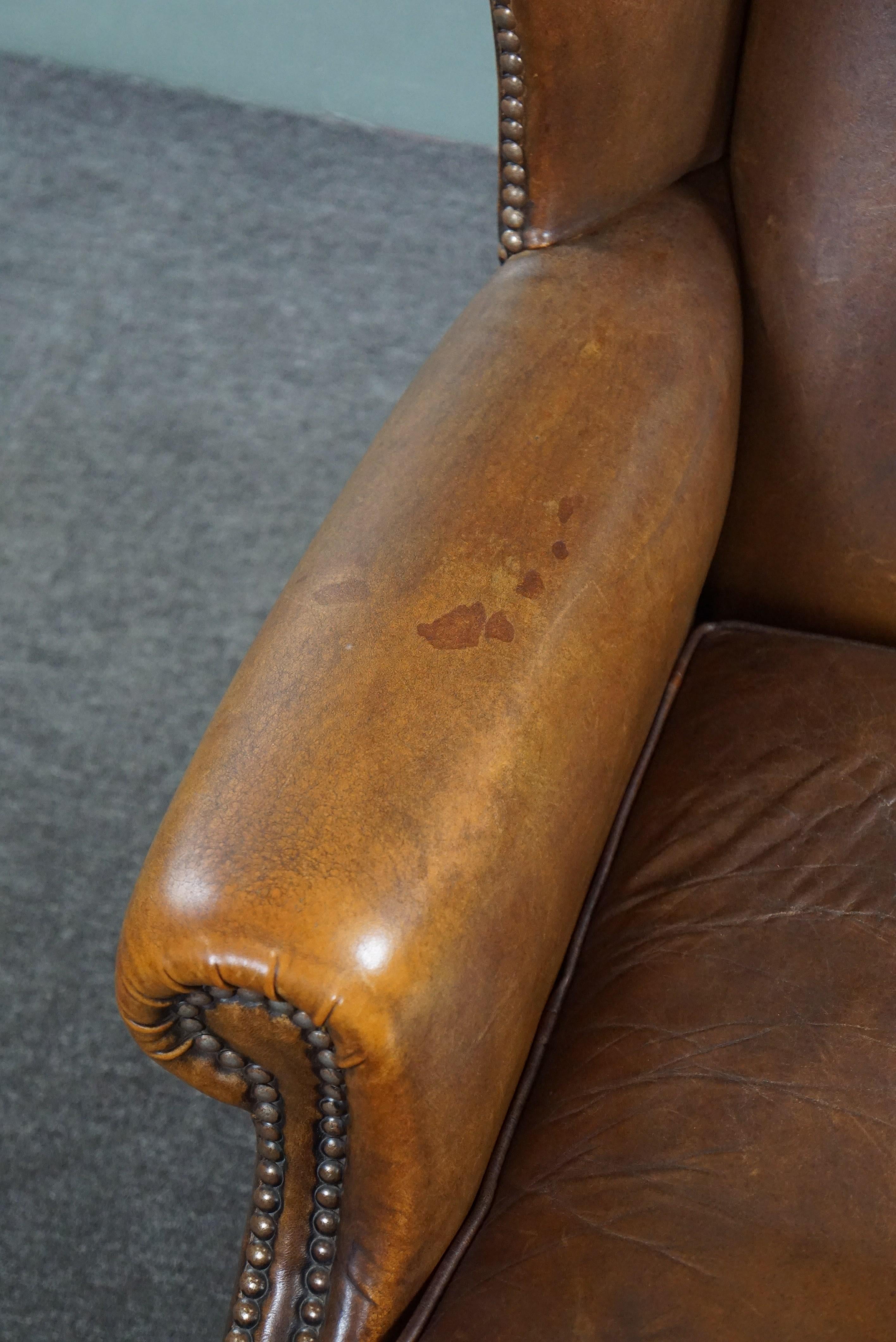 Wing armchair full of character, made of sheep leather For Sale 2