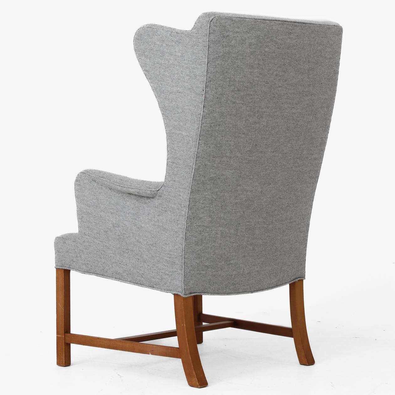 Wing back chair with cherry frame and new upholstery in Hallingdal 116. Designed in 1945. Børge Mogensen / Jacob Kjær.