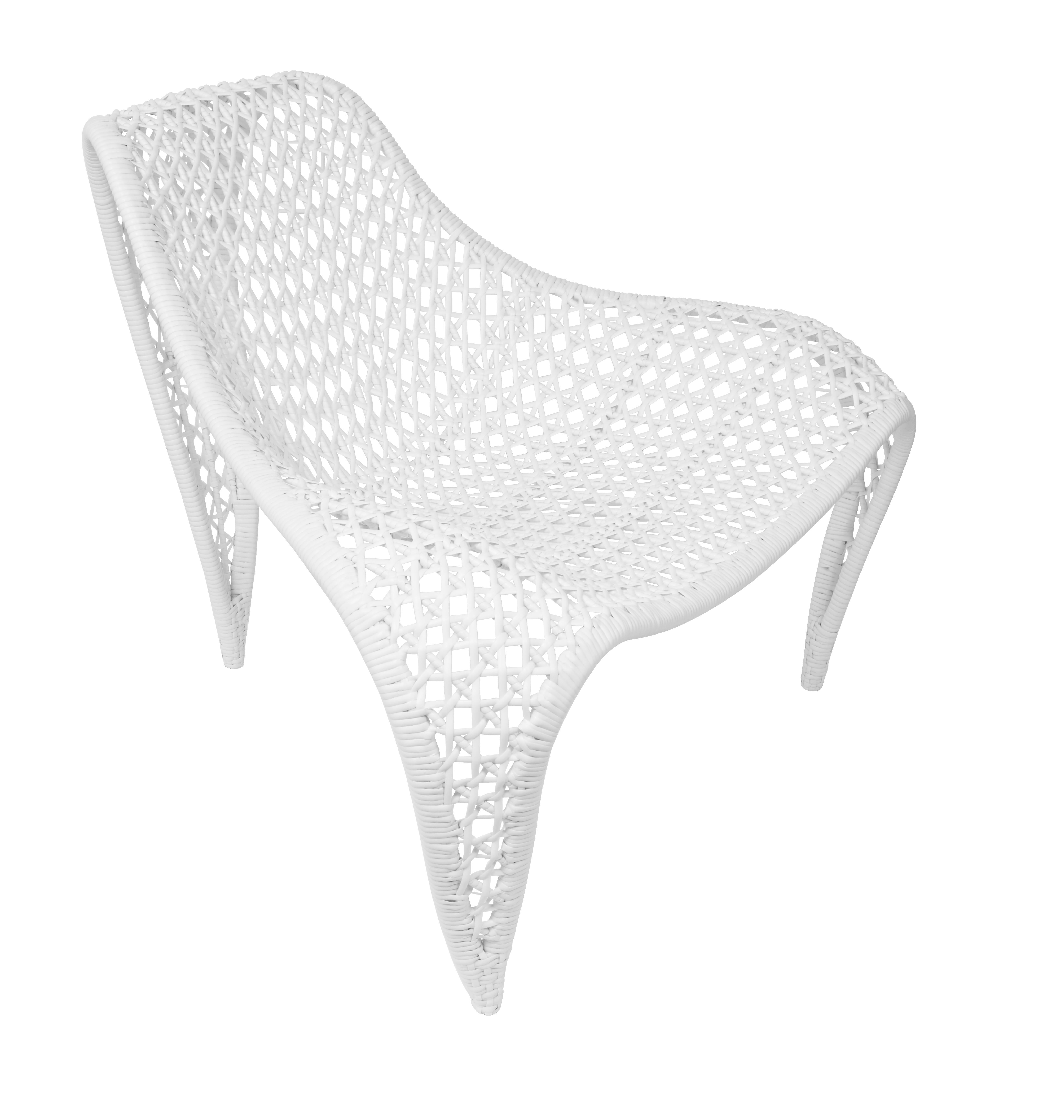 To enhance both style and comfort, supple woven leather gracefully envelops an intriguingly shaped chair.