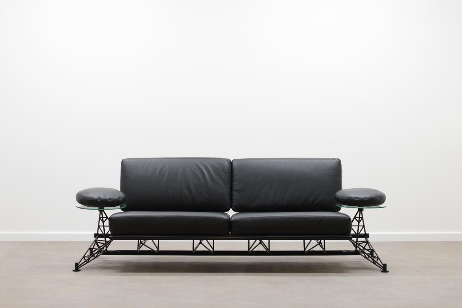 Wing sofa by Roy Fleetwood for Vitra 80’s. This is the 1st edition. Constructive metal frame, black leather cushions and glass tables / armrests. This sofa is completely restored. Frame is powder coated and reupholstered in black premium leather.