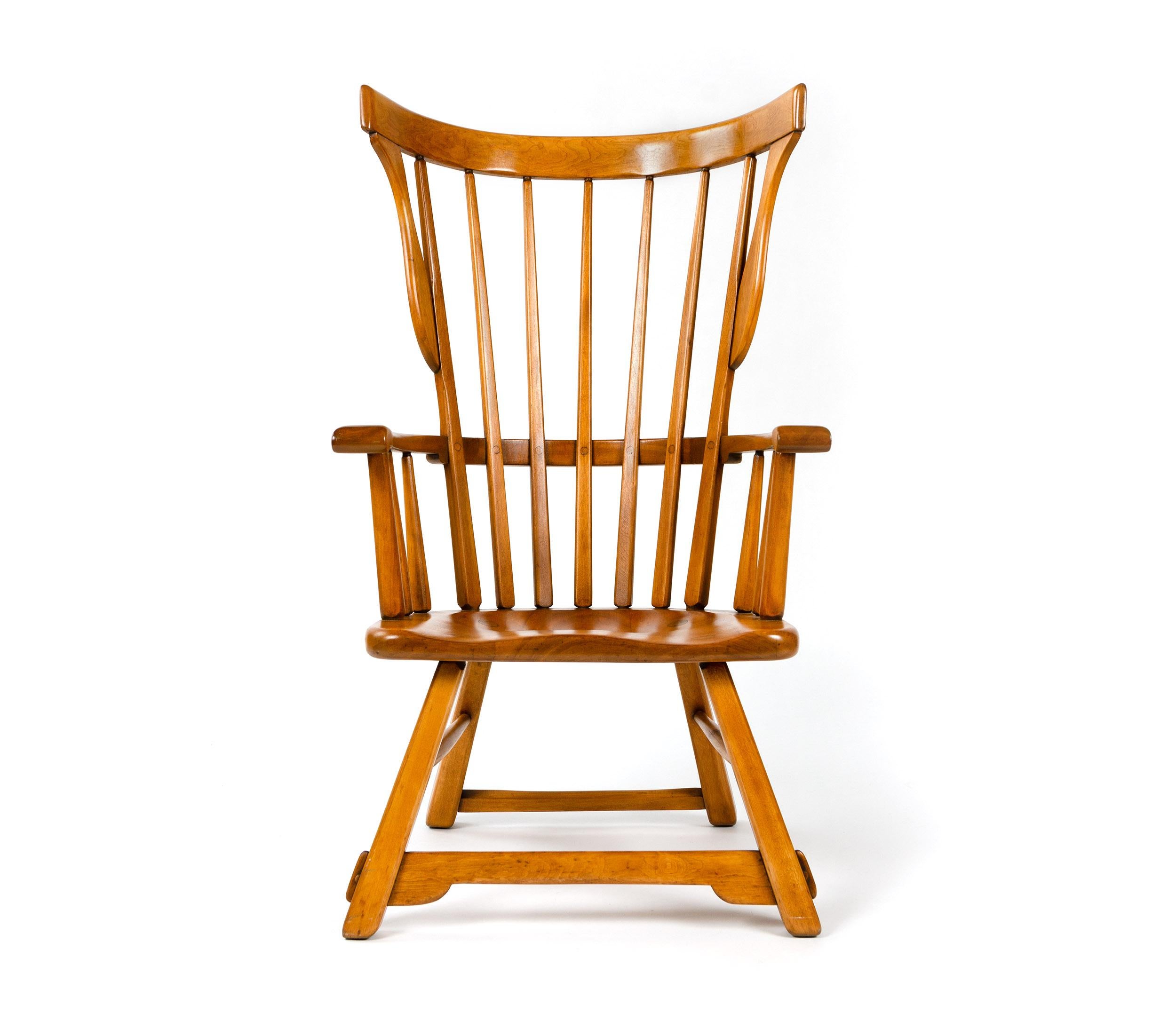 A Craftsman wingback armchair by Herman DeVries in solid maplewood; hand-hewn spindles, shaped seat on splayed squared legs. Crafted in the 1930s.