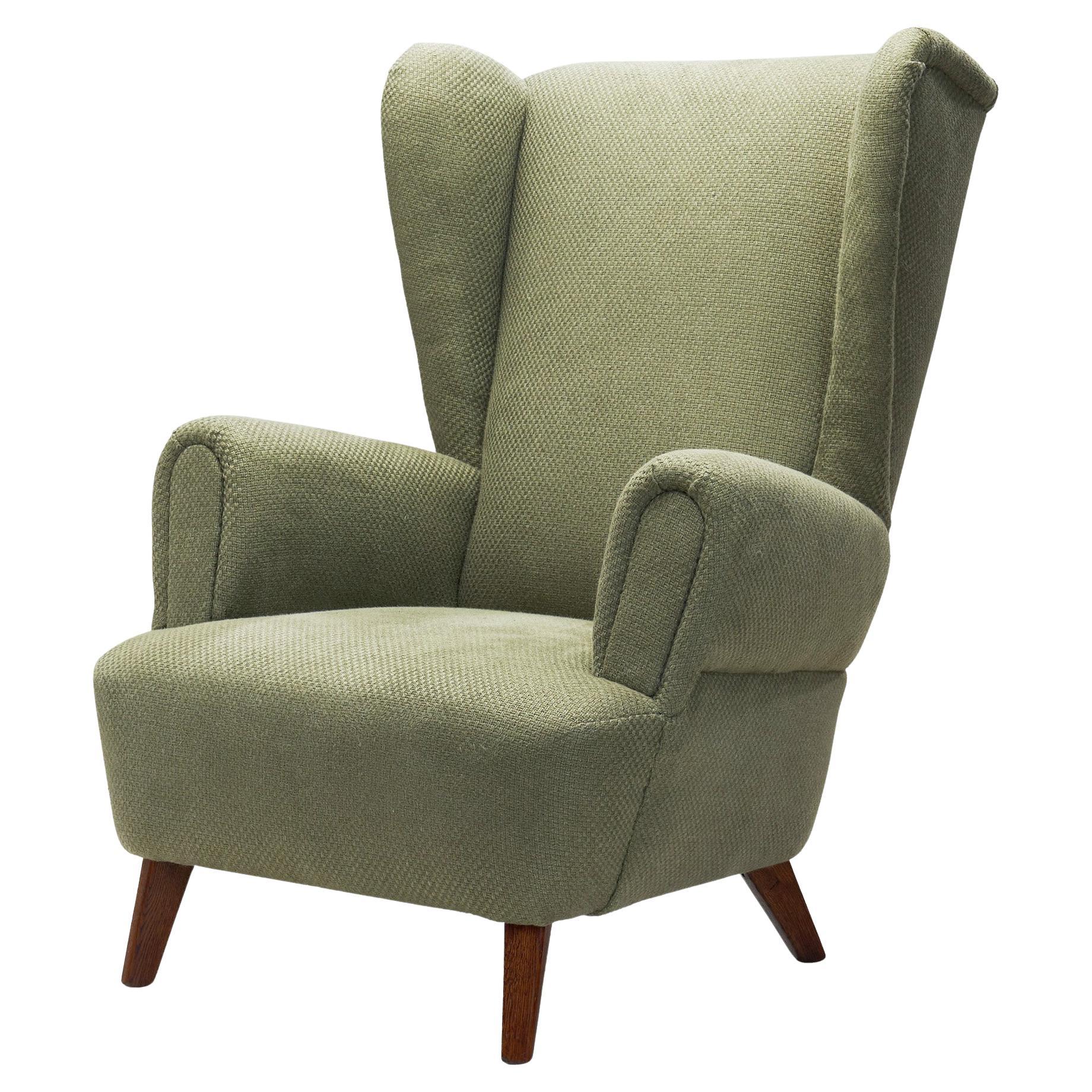 Wingback Armchair Upholstered in Dark Green, Europe Mid-20th Century