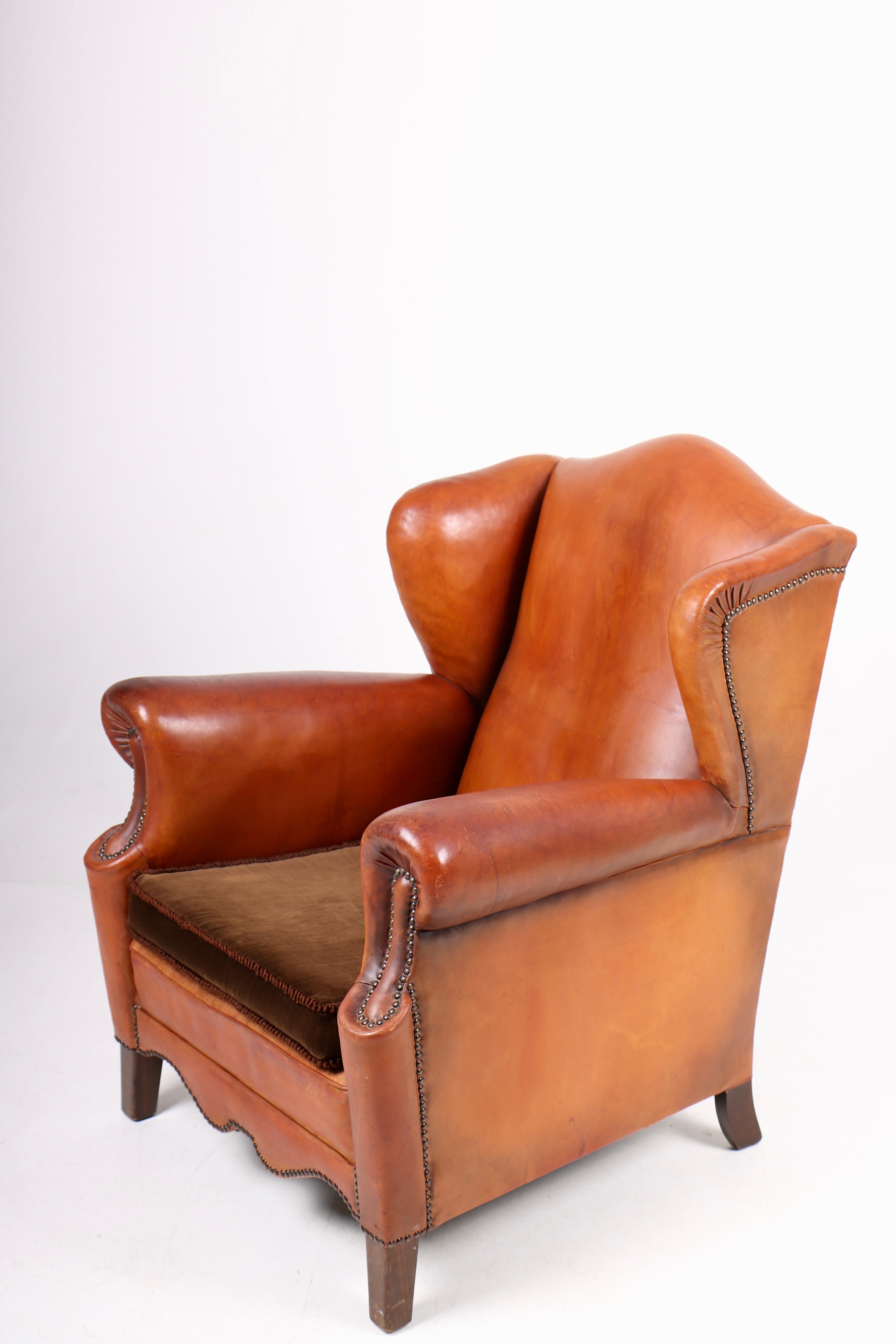 Scandinavian Modern Wingback Chair in Cognac Leather, Denmark, 1940s For Sale