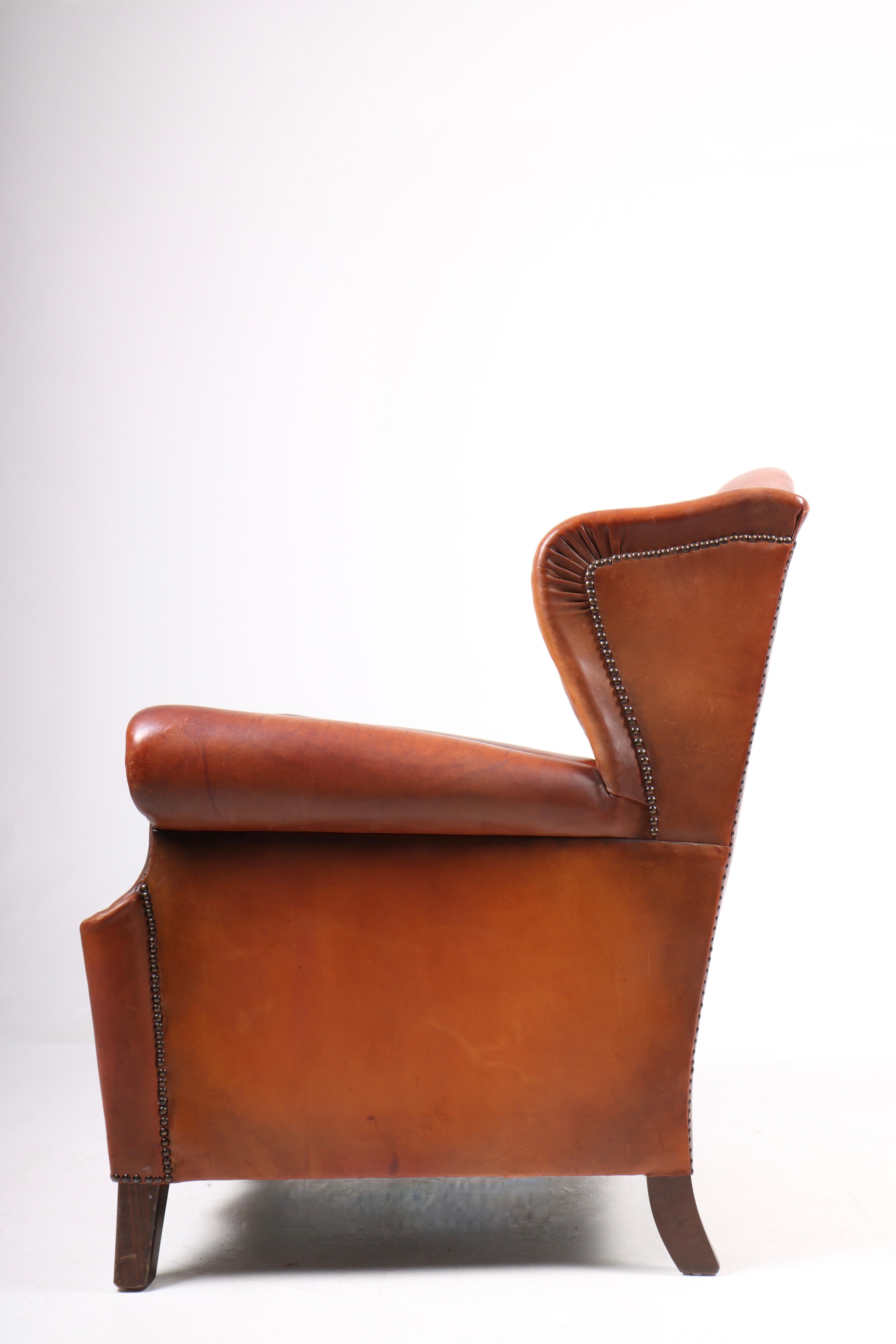 Danish Wingback Chair in Cognac Leather, Denmark, 1940s For Sale