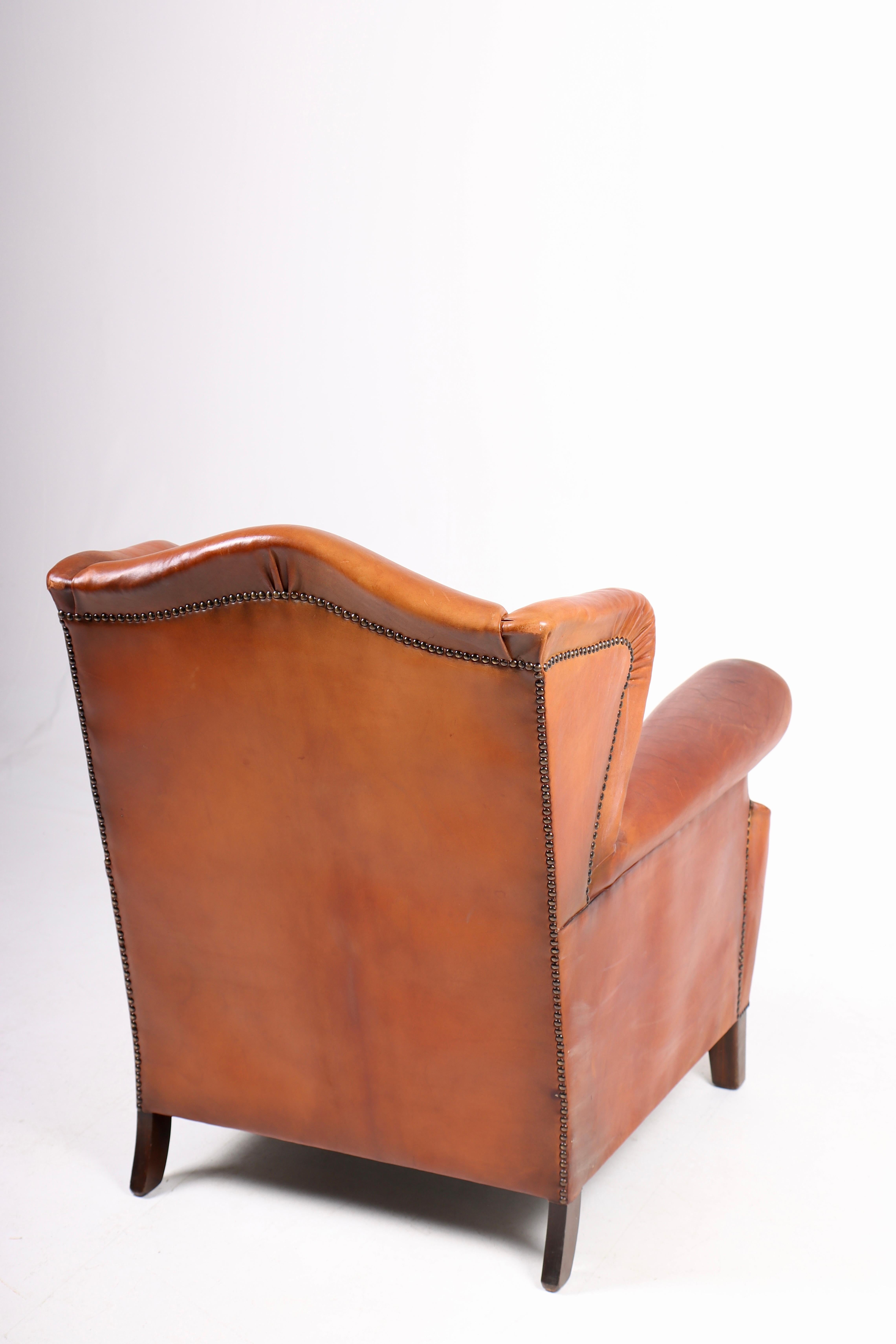 Mid-20th Century Wingback Chair in Cognac Leather, Denmark, 1940s For Sale
