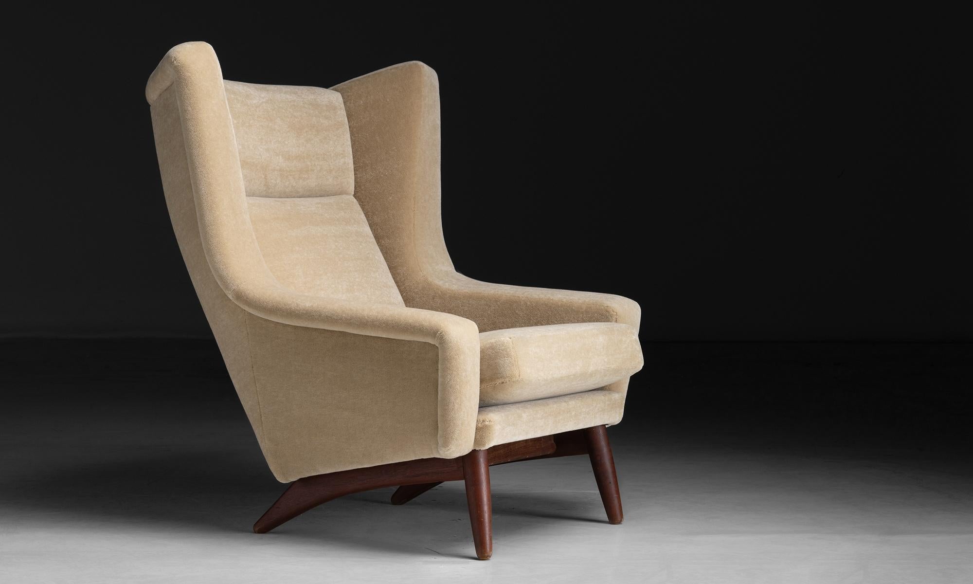 Wingback Chair in Mohair Velvet
Denmark circa 1960
Designed by Aage Christiansen, Newly upholstered in mohair, on teak legs.
37.5”w x 32”d x 39”h x 16”seat
Ref. MOD1046
$ 5,200