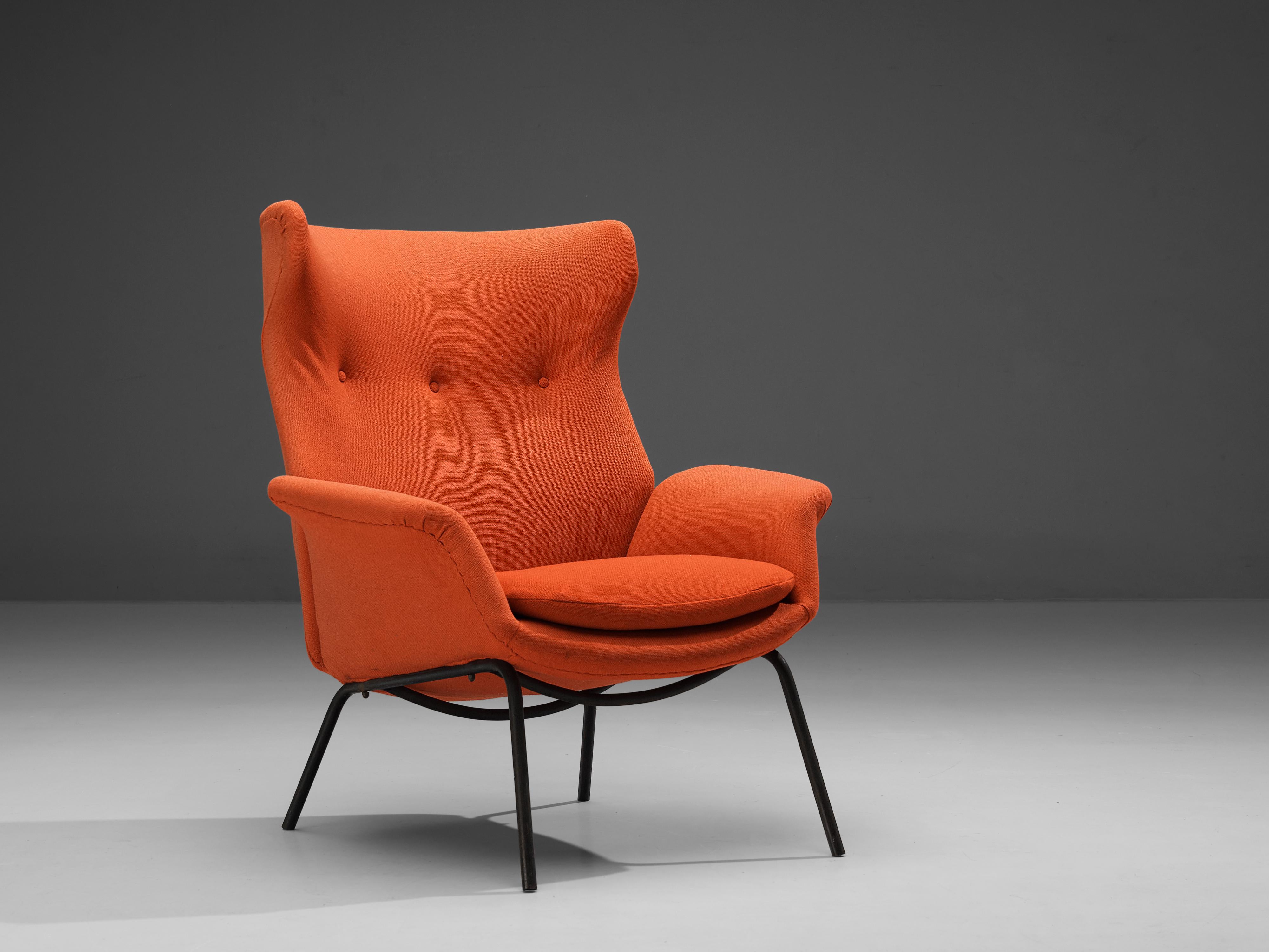 Wingback chair, metal, fabric, Italy, 1960s

Eccentric wingback chair in its original orange upholstery. The softness of the shell of this comfortable and quirky chair appears in the beautifully executed subtle lines and angles. The black coated