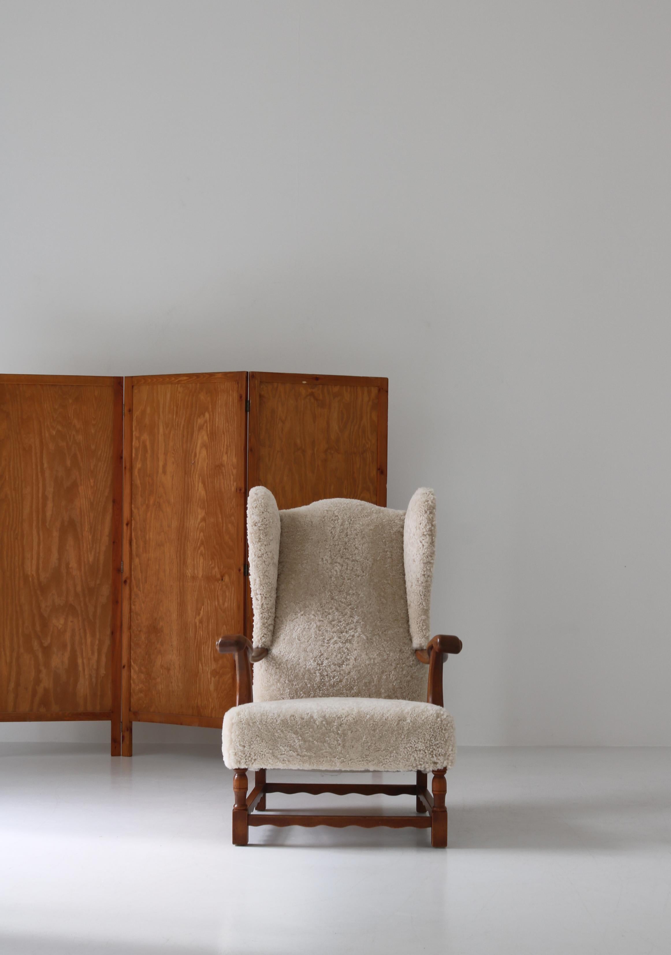 Mid-20th Century Wingback Lounge Chairs in Solid Oak and Sheepskin by Danish Cabinetmaker, 1940s