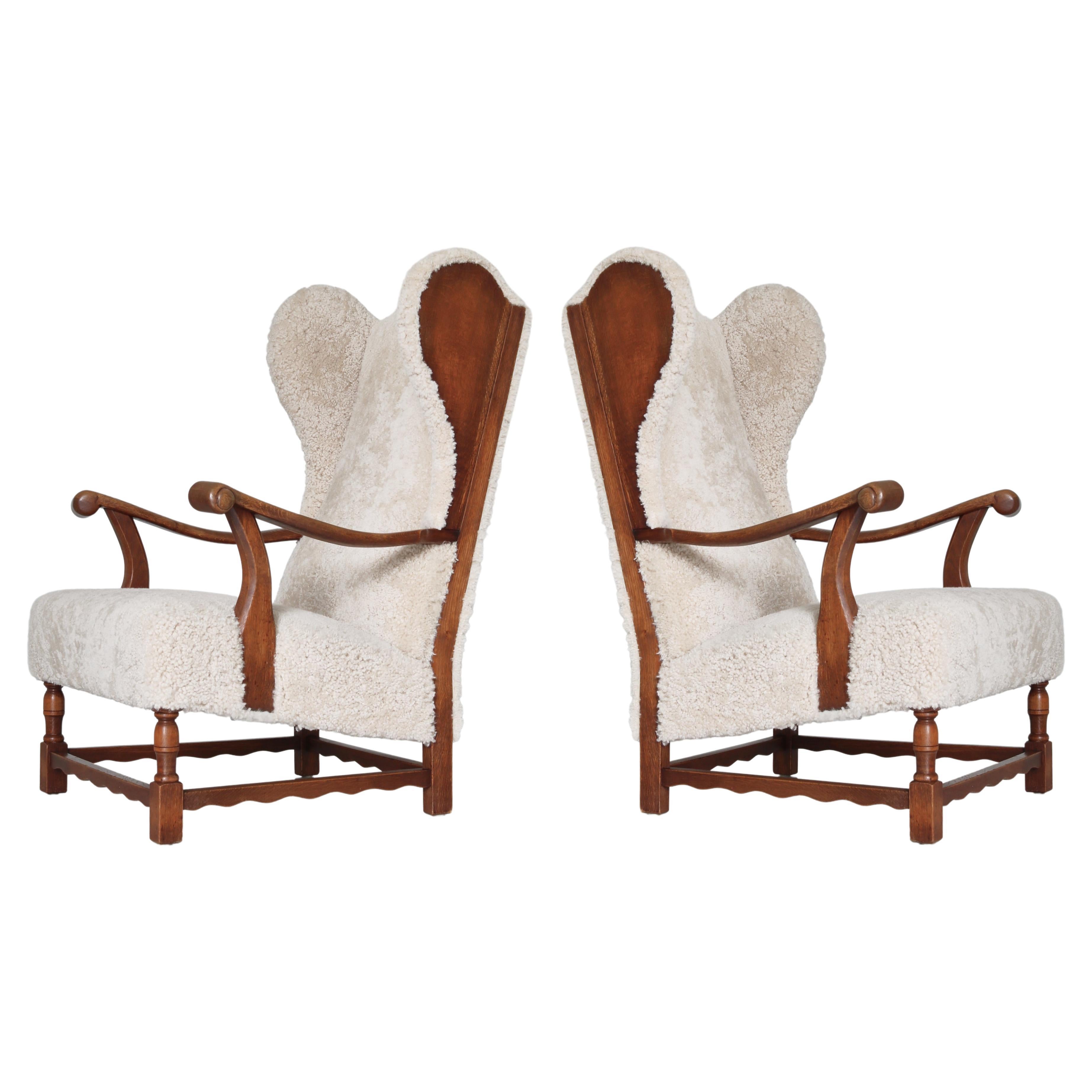 Wingback Lounge Chairs in Solid Oak and Sheepskin by Danish Cabinetmaker, 1940s