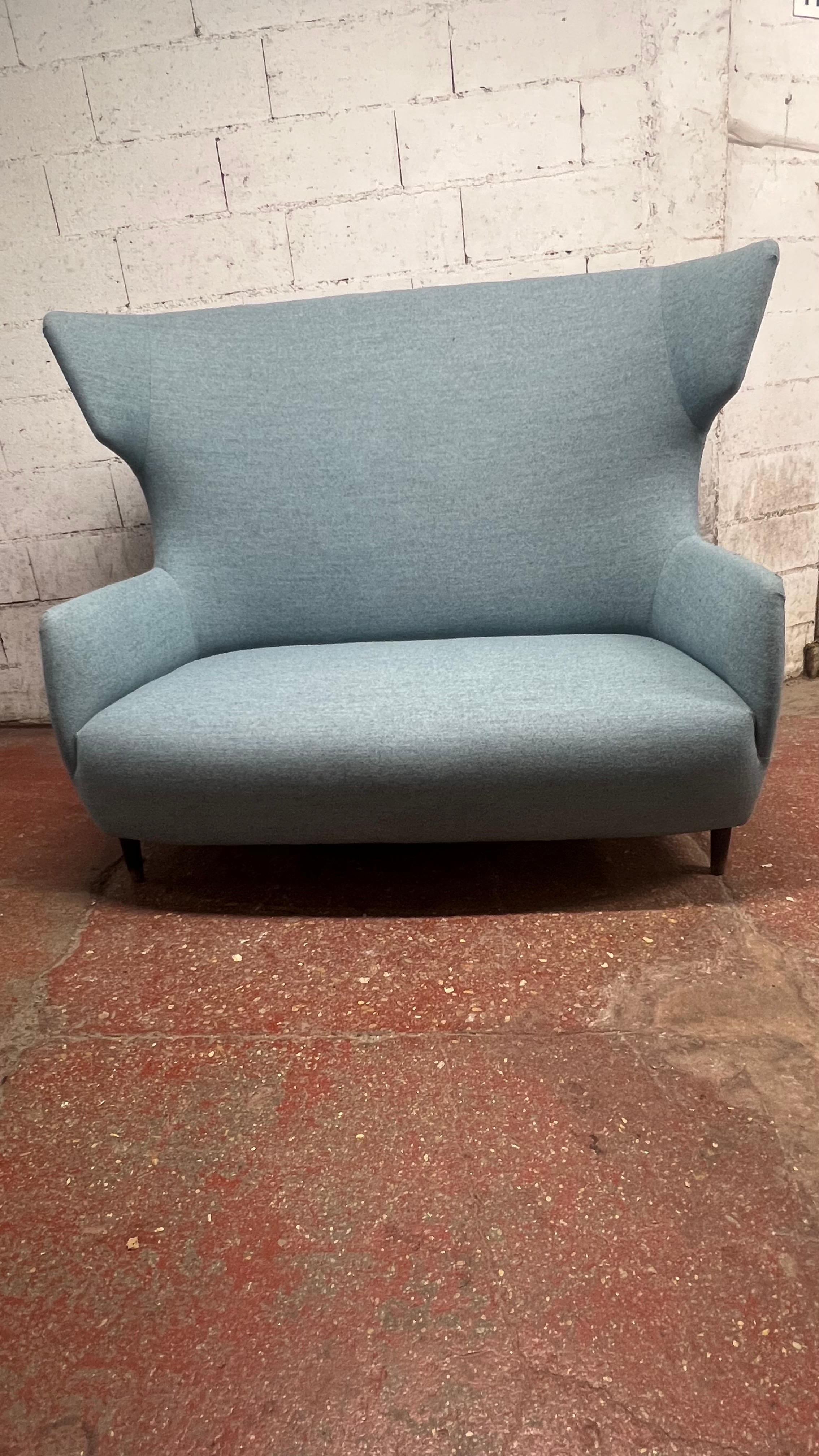 English Wingback sofa designed by Sean Dare For Sale