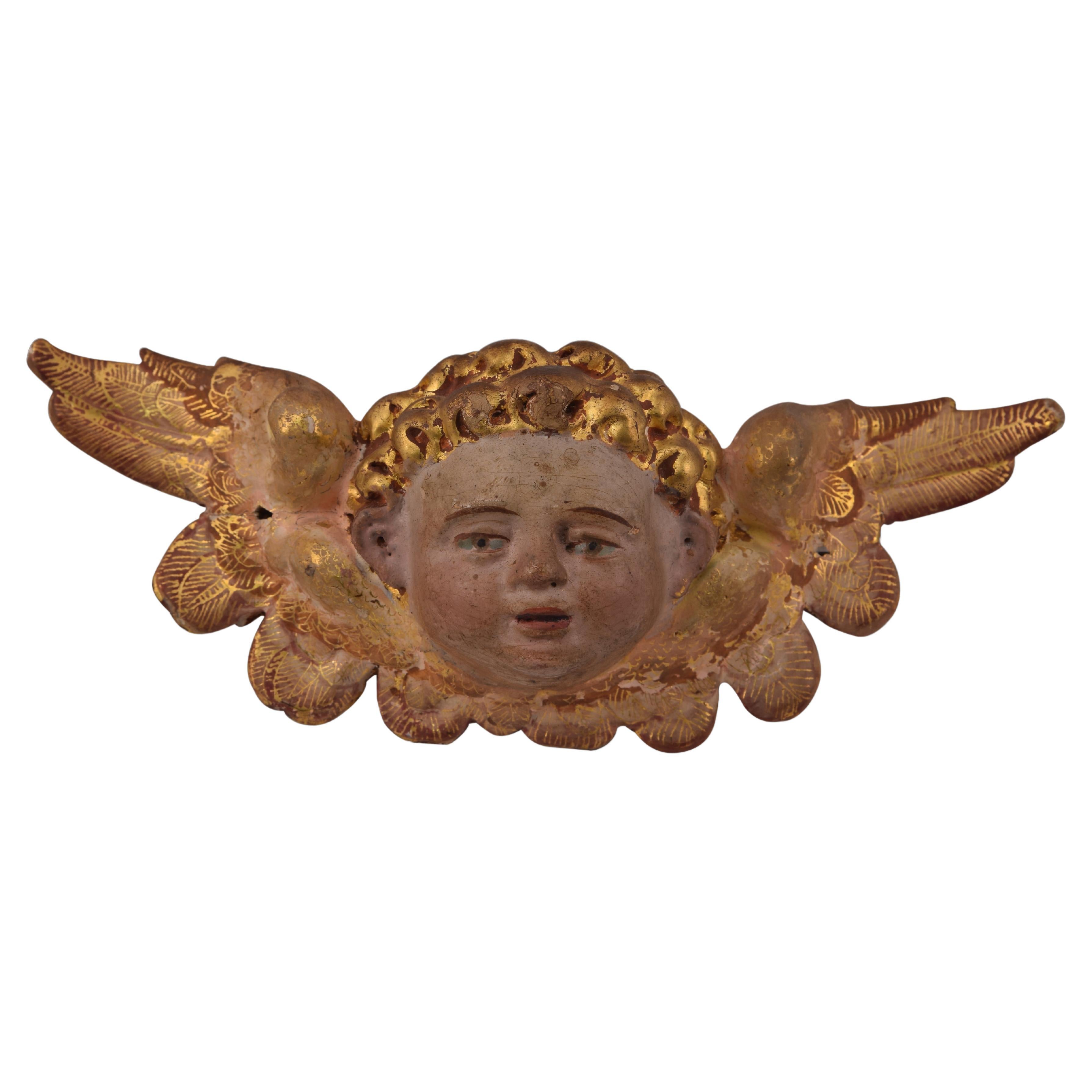 Winged angel head. Polychrome wood. Spanish school, 16th century.  For Sale