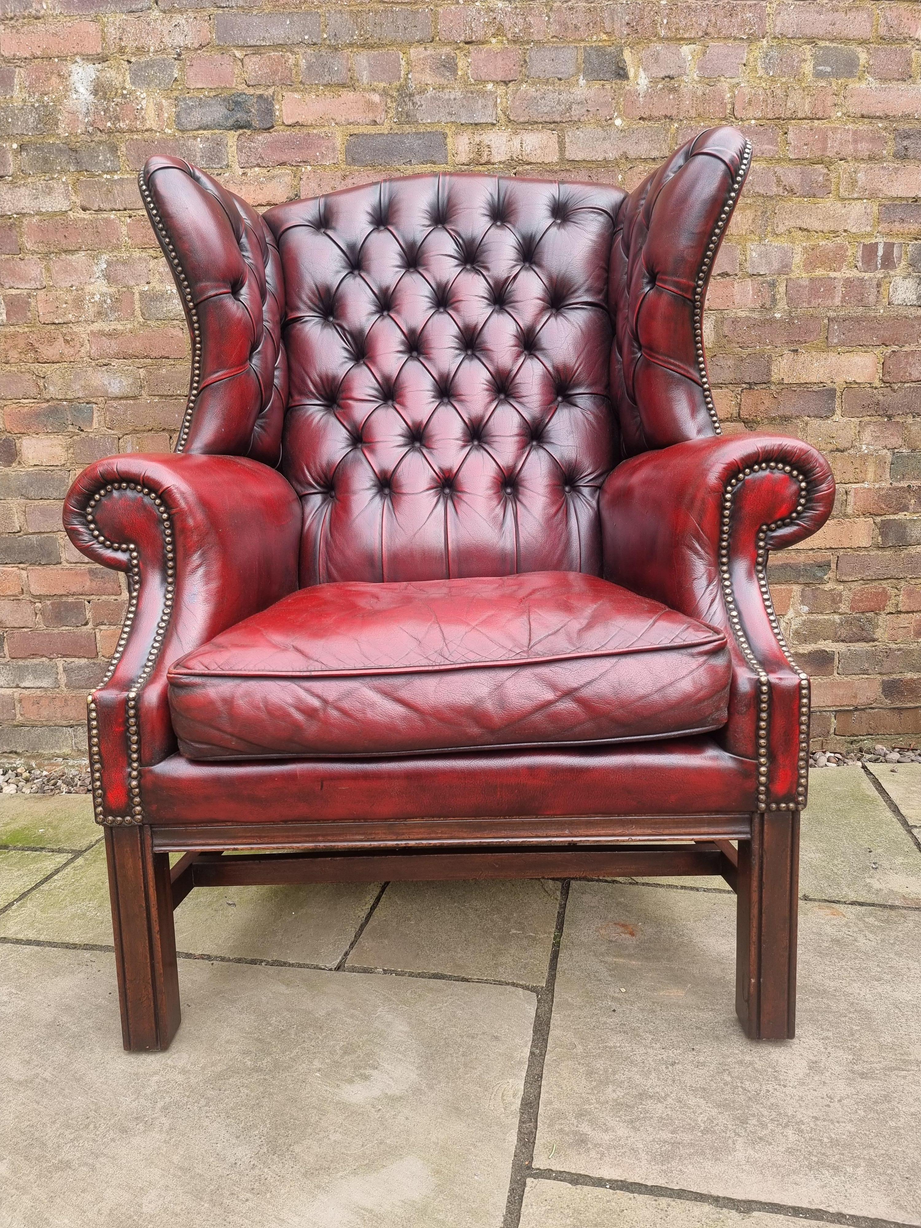 This highly decorative very large oversized winged armchair dates to circa 1930.

It stands on plain square moulded legs with matching stretchers. This chair is a statement piece ideal for a key position. It is very nicely detailed and has a good
