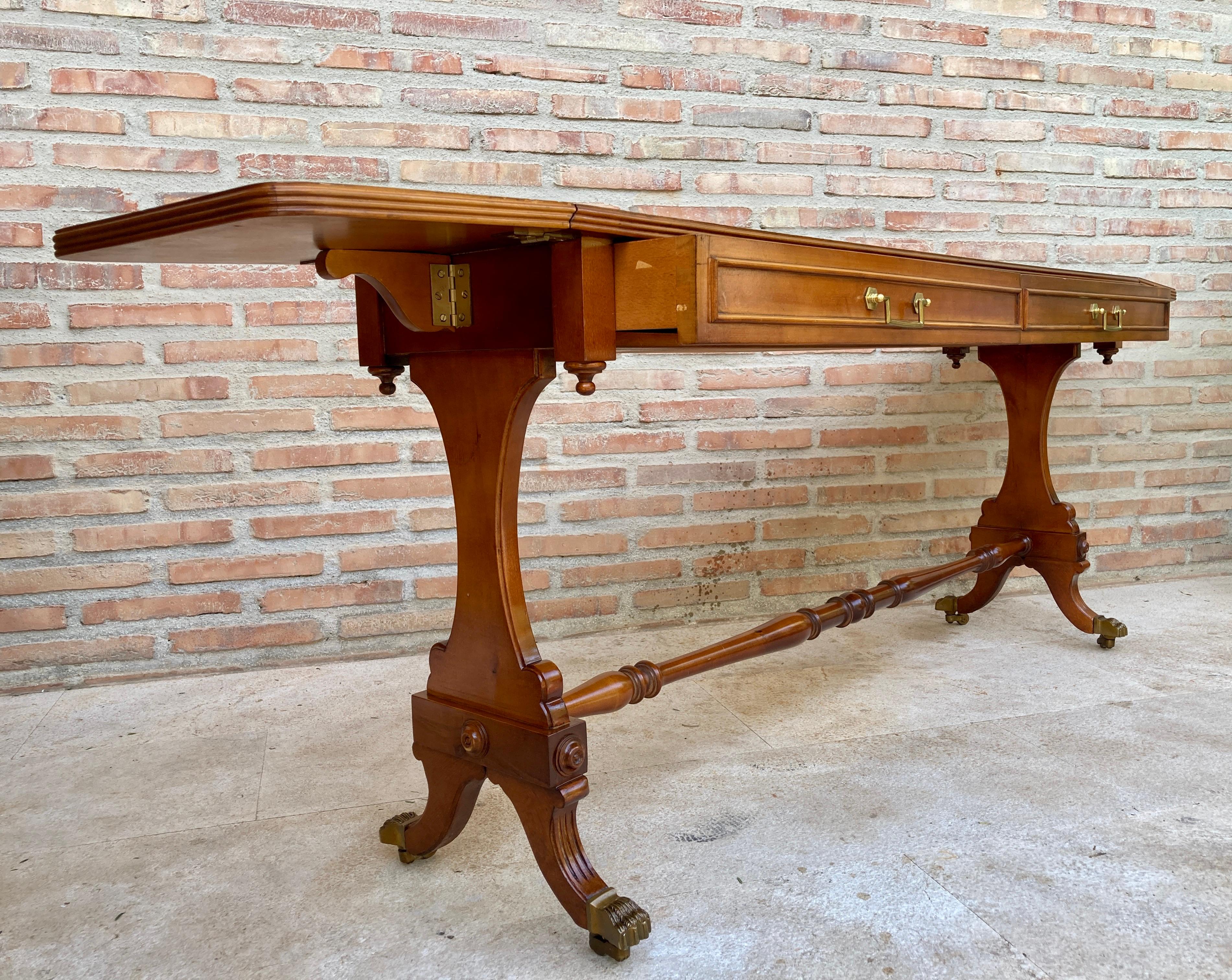 Winged Console Table in Walnut with Claw Feet in Bronze with Drawers and Wheels In Good Condition For Sale In Miami, FL