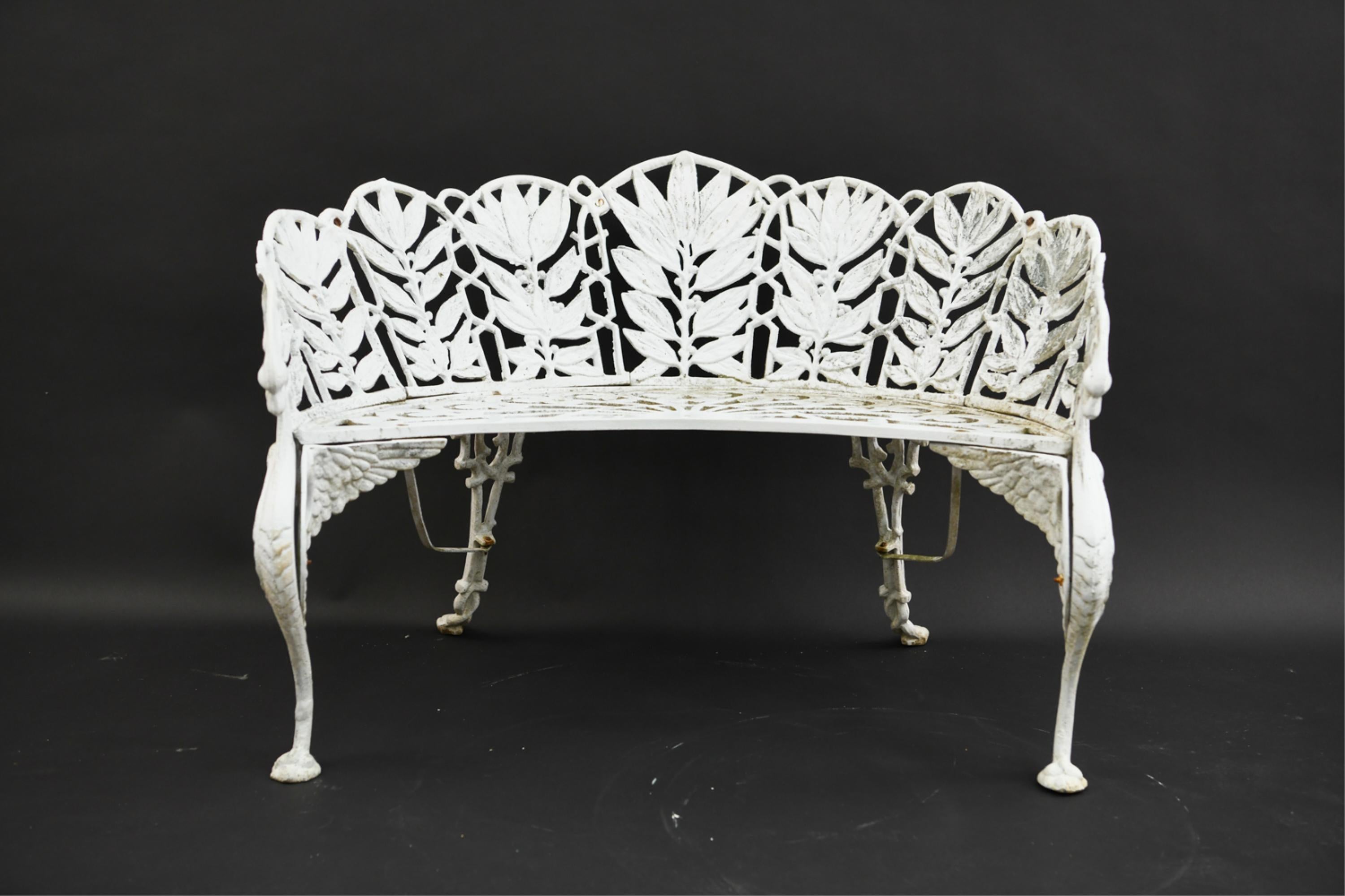 Rare set of Coalbrookdale style 3 cast aluminum laurel leaf motif design garden or patio bench and two matching armchairs with winged Griffen design leg supports painted white, after the originally produced by J. L. Mott. Perfect for summer