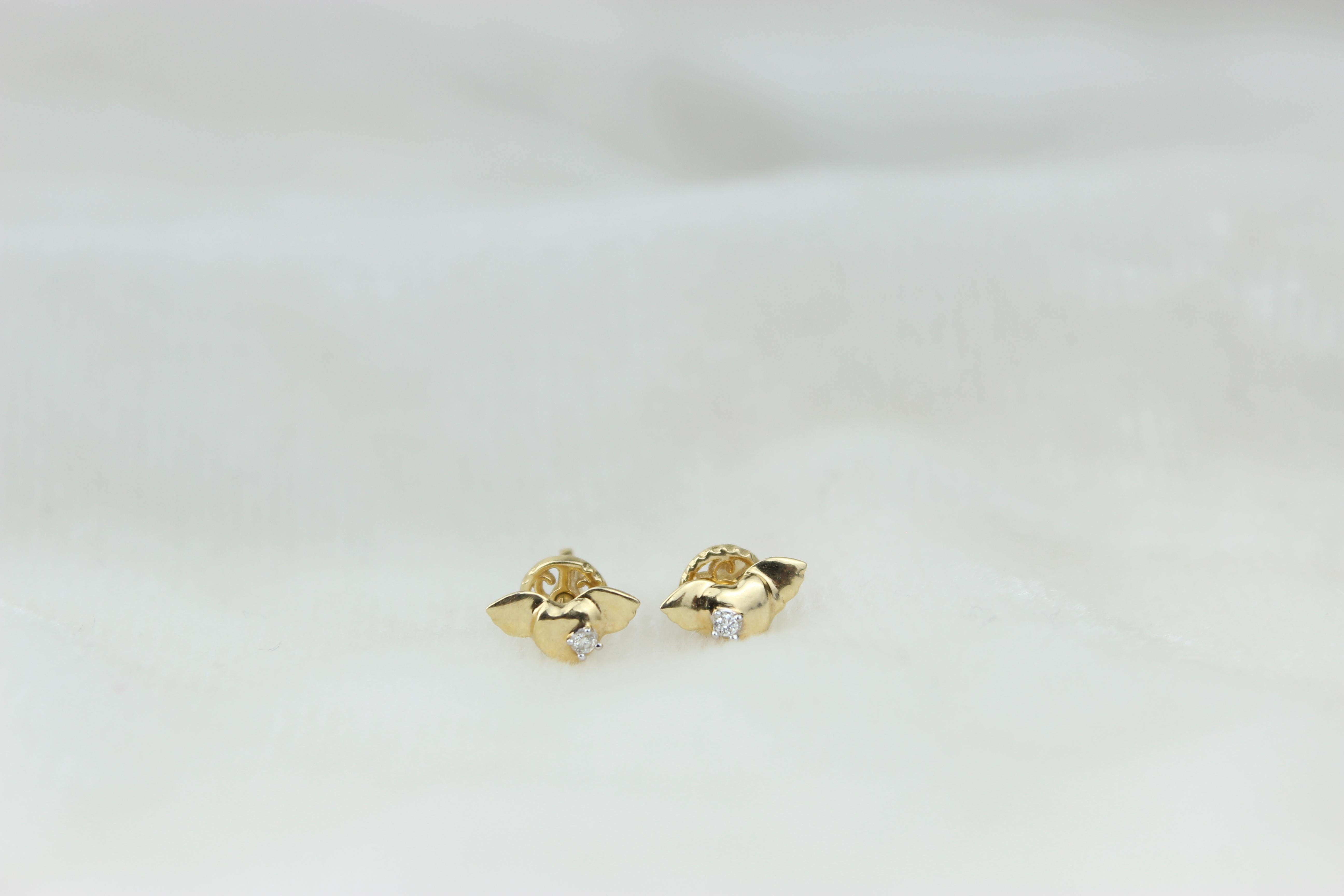Winged Heart Diamond Earrings for Girls (Kids/Toddlers) in 18K Solid Gold are enchanting and delicate jewelry pieces designed specifically for young children. These earrings feature a charming winged heart design crafted from high-quality 18K solid