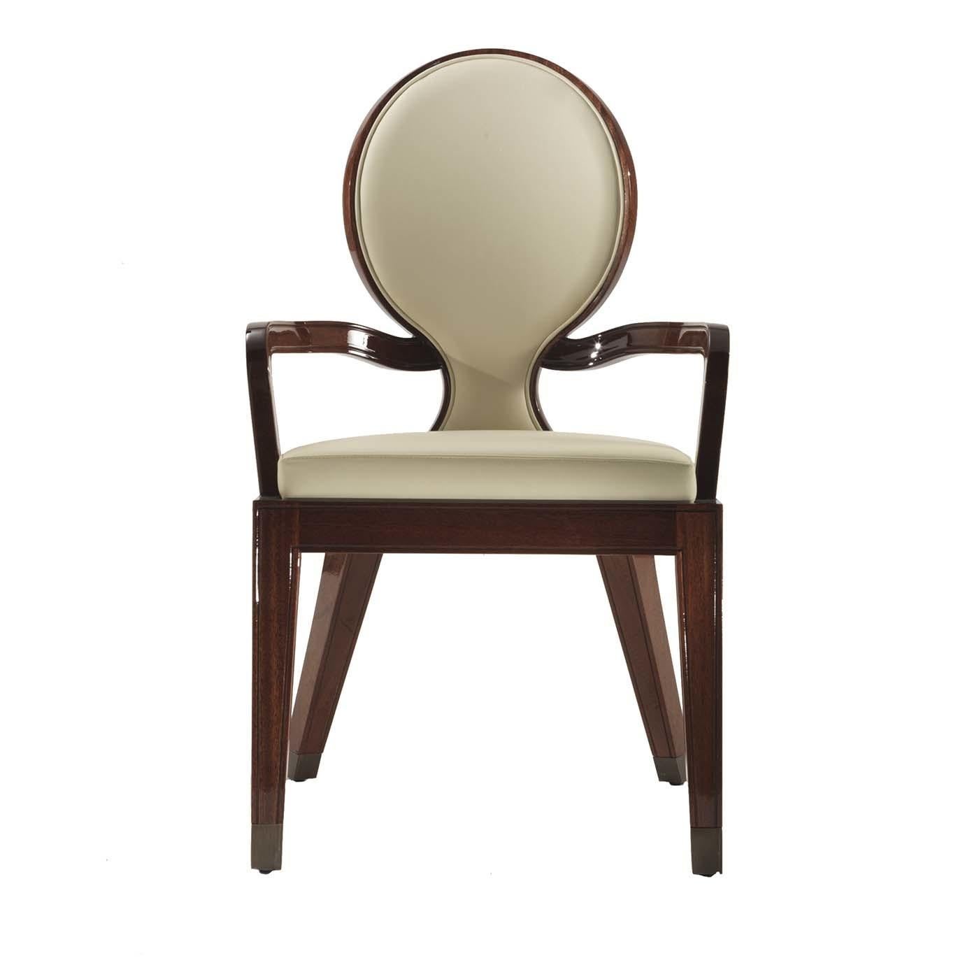 Part of a stunning series of chairs named Sun for the elegant oval-shaped backrest, this piece exudes a refined allure, thanks to its elegant silhouette that combines straight, diagonal, and sinuous lines. The structure in wood with a glossy