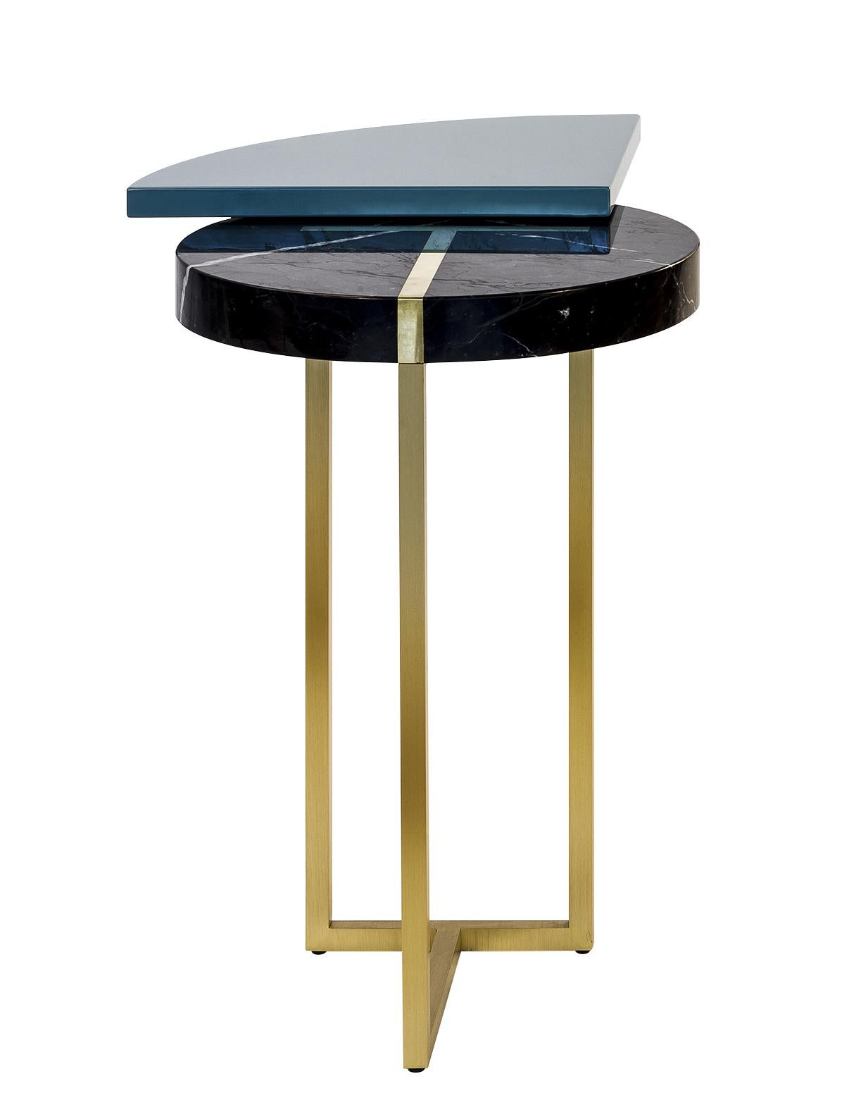 Wings end table by Hagit Pincovici
Dimensions: 54 L x 36 W x 48 H
Materials: Lacquered wood, Marquina marble, Brass

Hagit Pincovici founded her eponymous bespoke luxury furniture and lighting atelier in 2014. Known in her earlier work for a