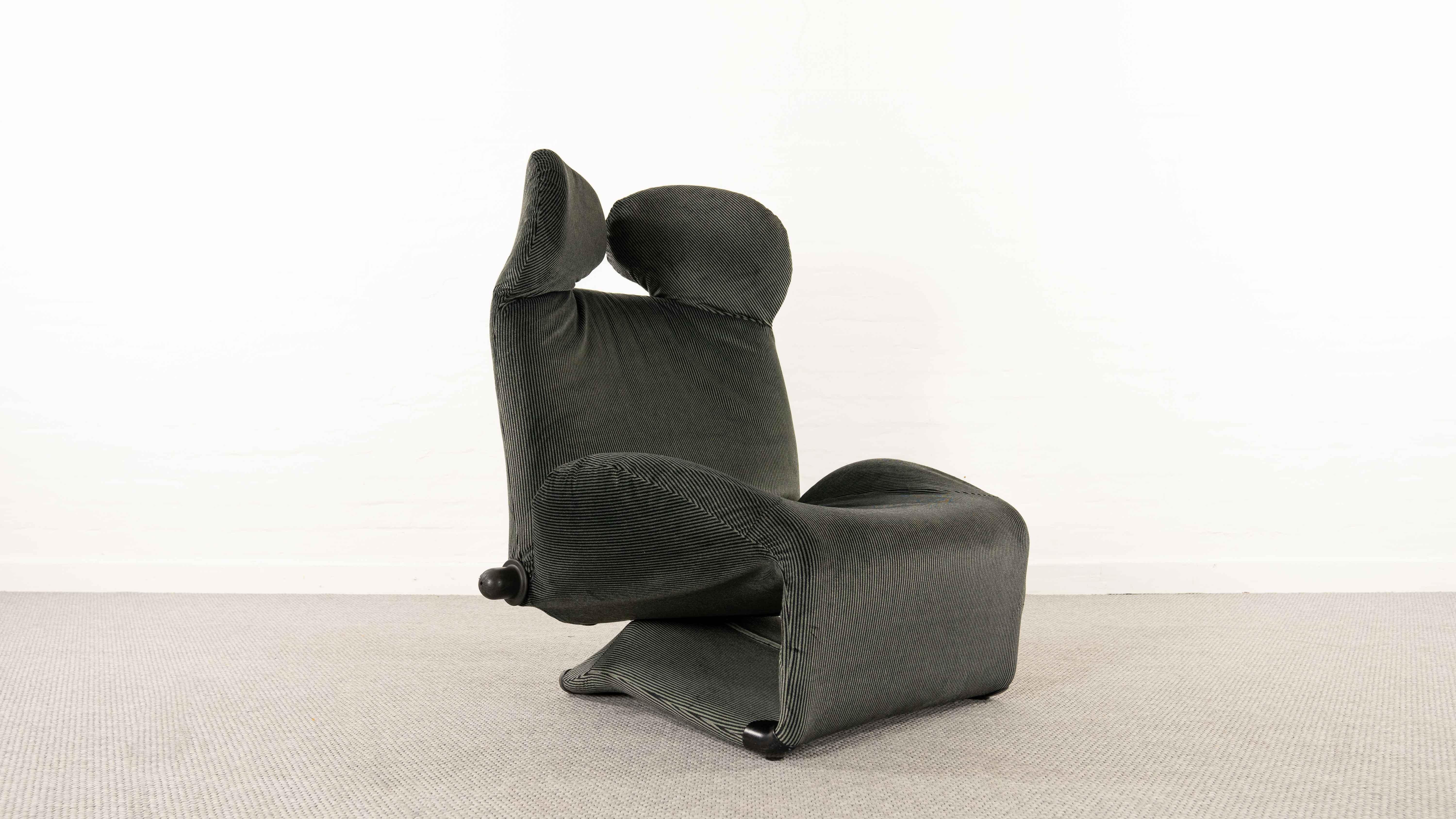 Famous so called “Micky Mouse Chair” by Toshiyuki Kita 1980 for Cassina. New upholstered in striped Maralunga fabrics. Various adjustable Easy Chair. The backrest can be adjusted by a turningknob, like in a car. By folding out the footrest, the