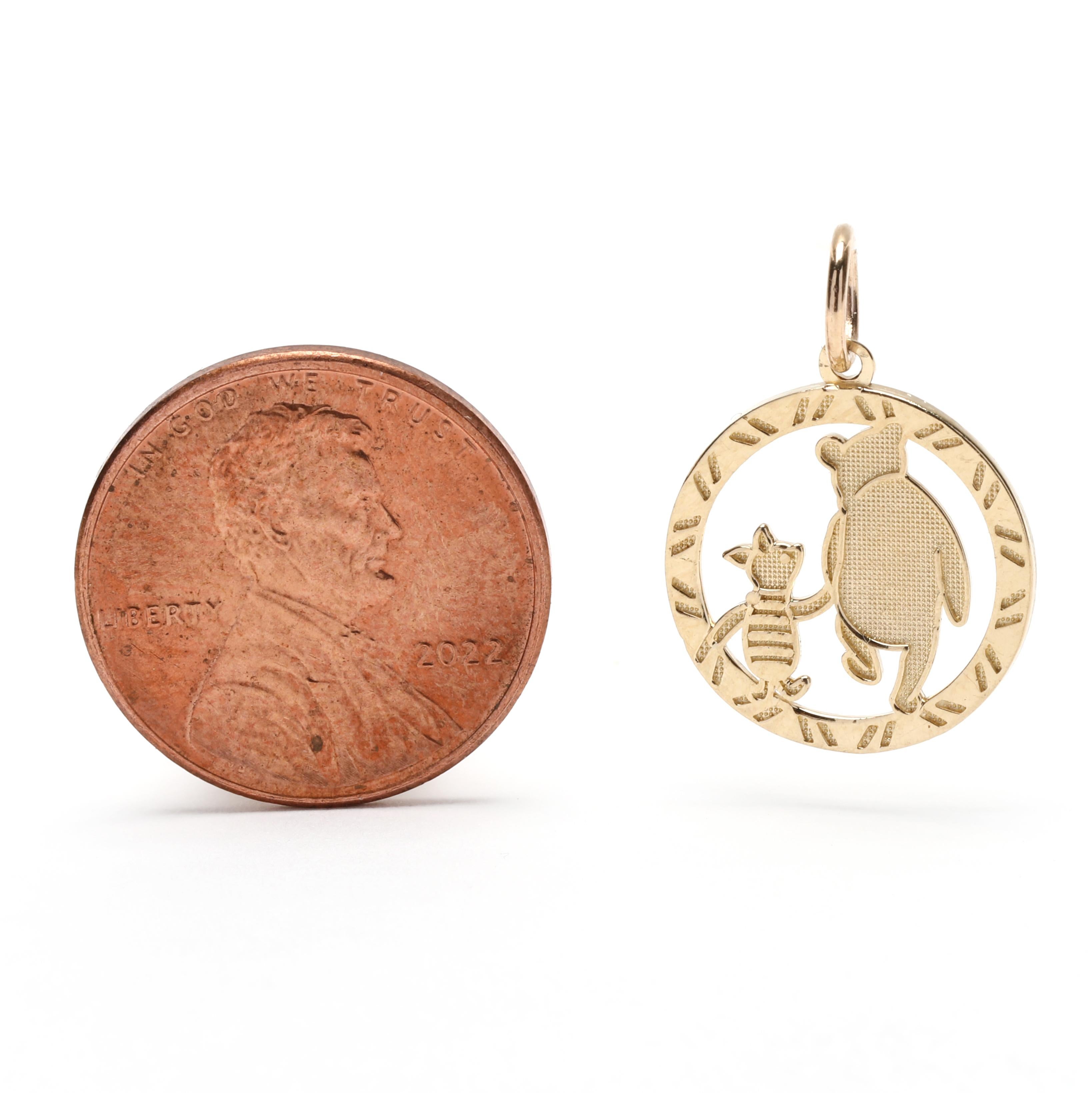 This charming 14K yellow gold Winnie the Pooh and Piglet charm is the perfect way to add a little Disney magic to any necklace or bracelet. The tiny charm measures 3/4 inch in length and features the lovable characters from the Hundred Acre Woods,