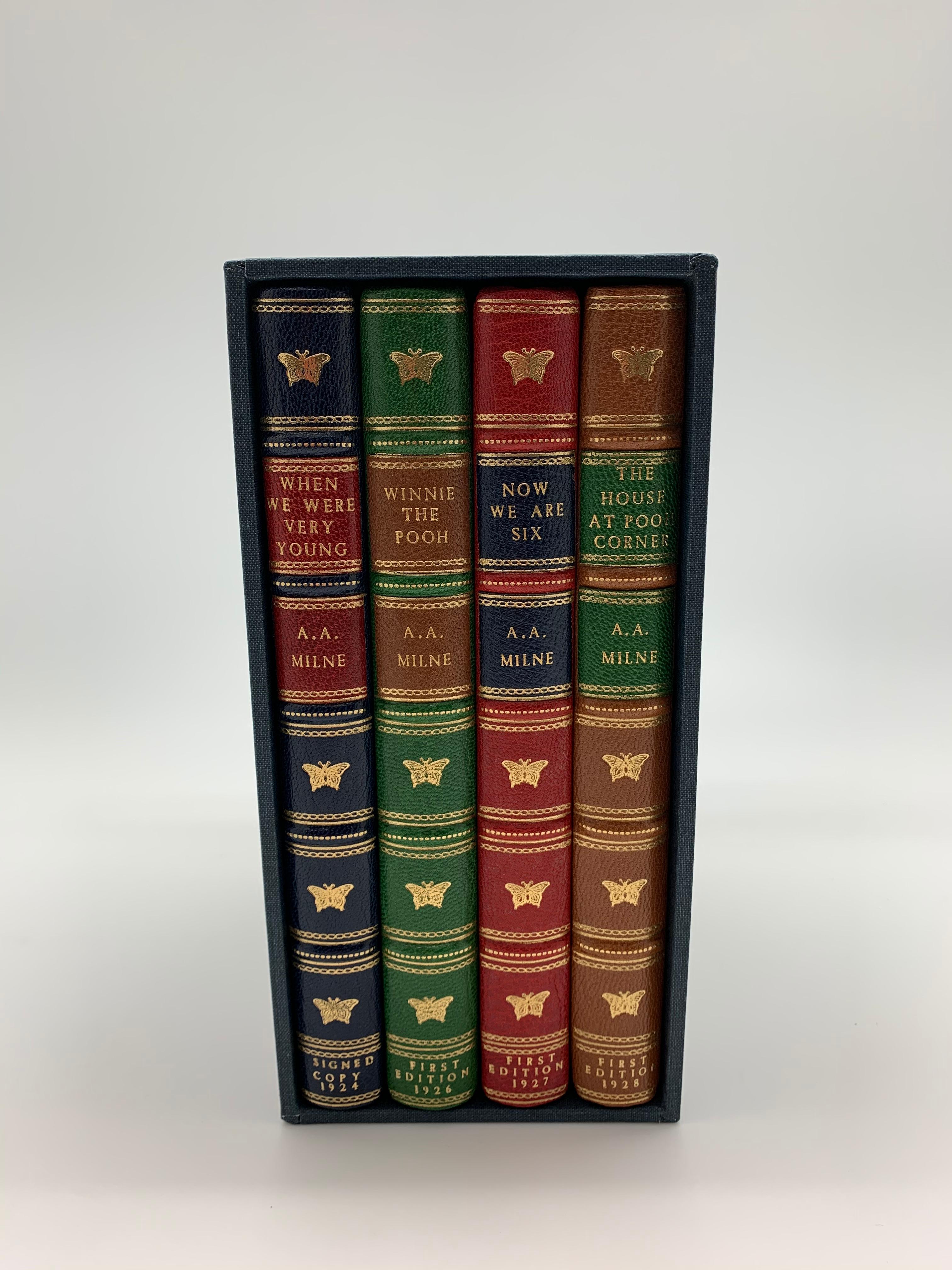 This is a complete leather-bound set of A. A. Milne's Classic children's books based on the adventures of Christopher Robin and Winnie the Pooh. The set includes three first edition printings and one later printing signed and inscribed by A.A.