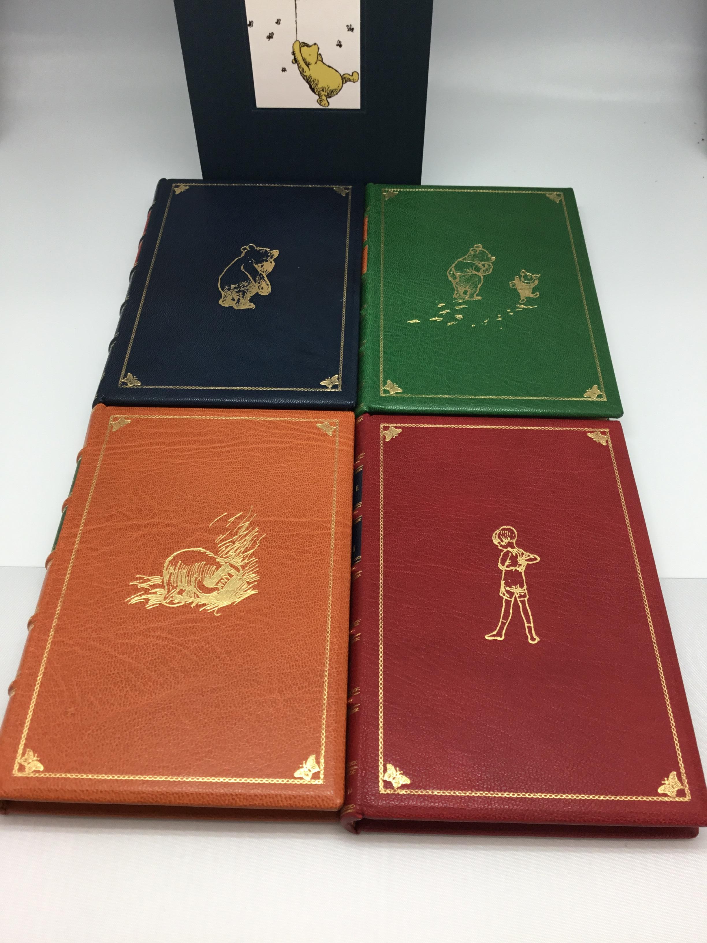 Milne, A. A. The Four Pooh Books: When We Were Very Young; Winnie The Pooh; Now We Are Six; The House At Pooh Corner. London: Methuen, 1924-28. Four volumes. Bound in full Morocco leather with gold embossing to the boards and spines and housed in a
