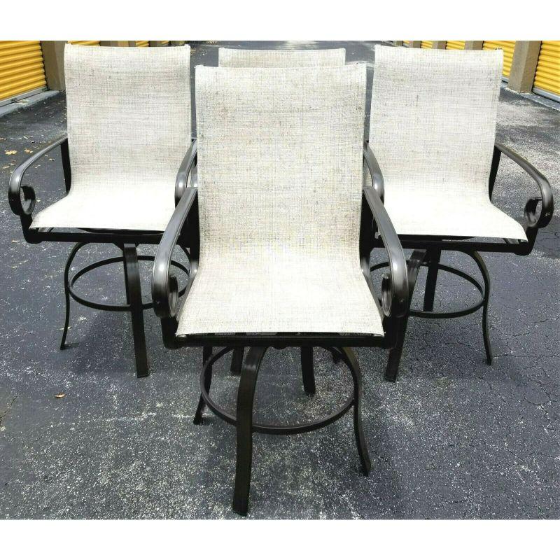 Offering one of our recent palm beach estate fine furniture acquisitions of A 
Set of 4 Winston Veneto Outdoor Sling Cast Aluminum Side Swivel Bar Stools
Frame color is brown

Measurements
49