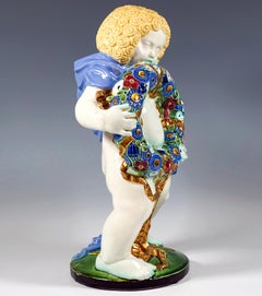 Invierno", Putto con corona de flores, Michael Powolny, Cerámica de Viena, 1910-1912