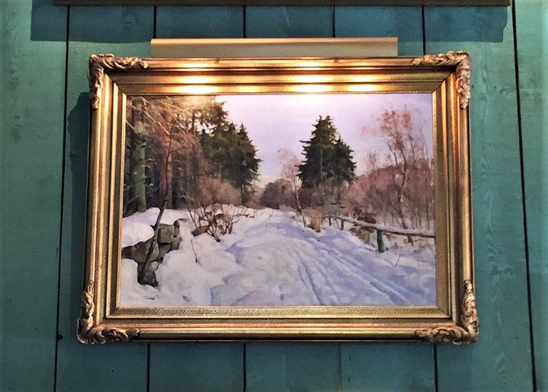 Harald Pryn, Danish 1891-1968
Winter scene, signedoil on canvas

Winter Landscape with Snow – Harald Julius Niels Pryn Danish, 1891–1968, a Winter landscape depicting a rural country lane with snow drifting alongside the hedgerow.
This painting
